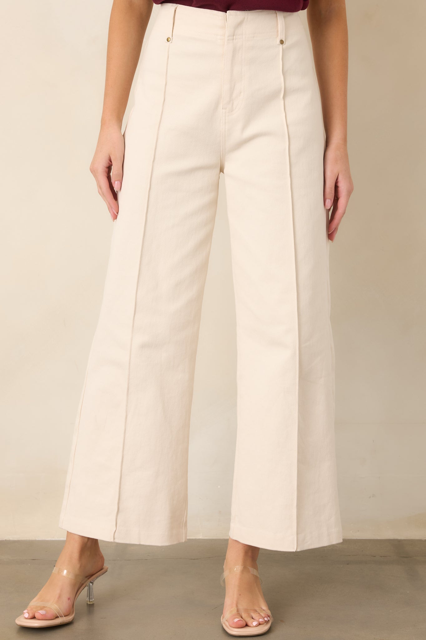 Close view of the streamlined pant front highlighting the structured pleats and comfortable stretch construction.