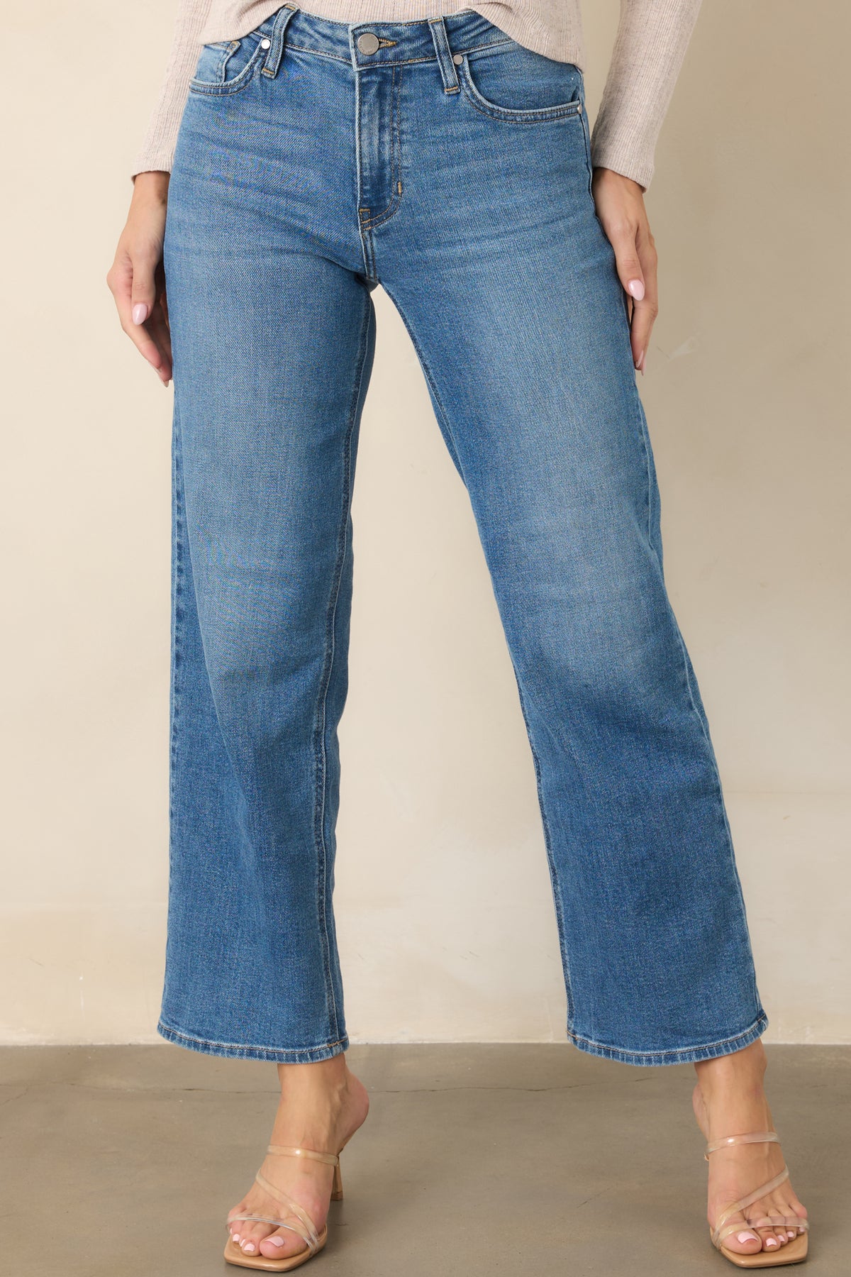 Stretch cotton-blend jeans showcasing the mid-rise waist, slim hips, and structured leg shape.