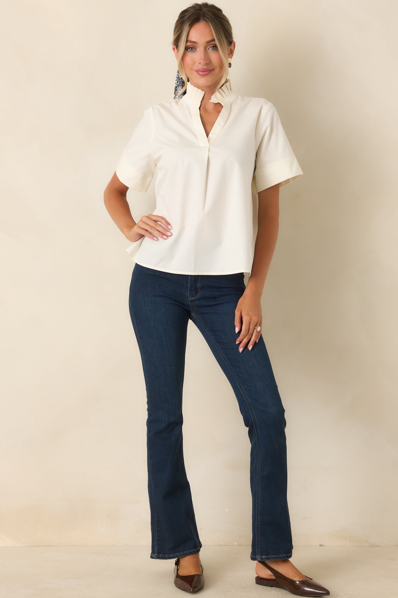Soft stretch denim jeans designed with a flattering high-rise fit, subtle flare silhouette, and timeless dark wash finish.