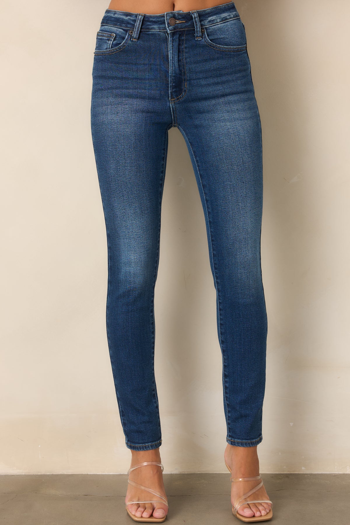 Stretch dark wash jeans with a structured feel and close-fitting leg shape.