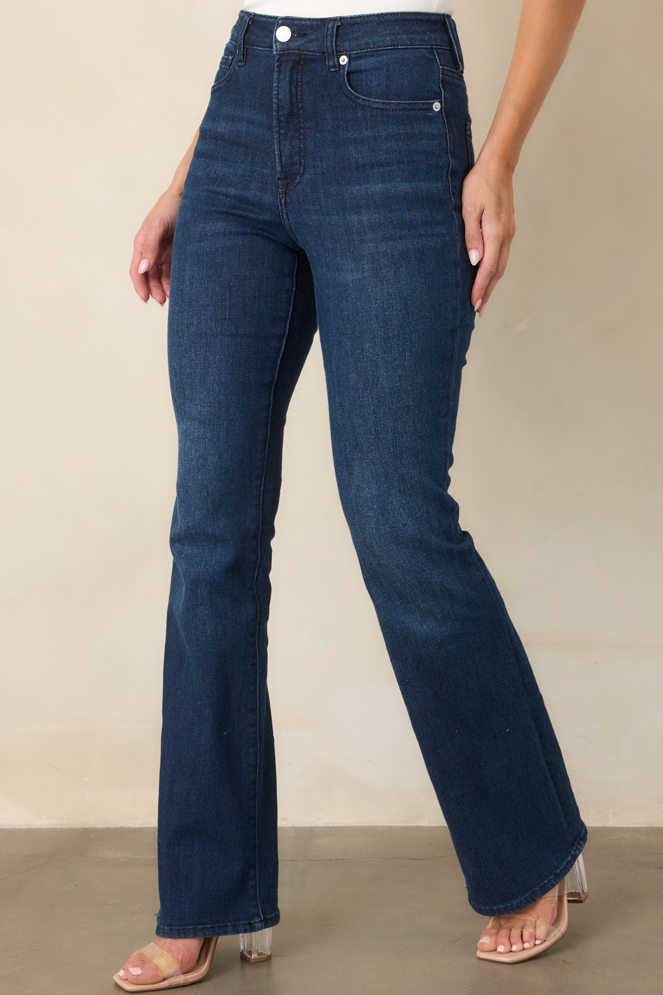 Detailed view of the stretch denim showcasing the streamlined fit through the hips and thighs and gradual bootcut opening.