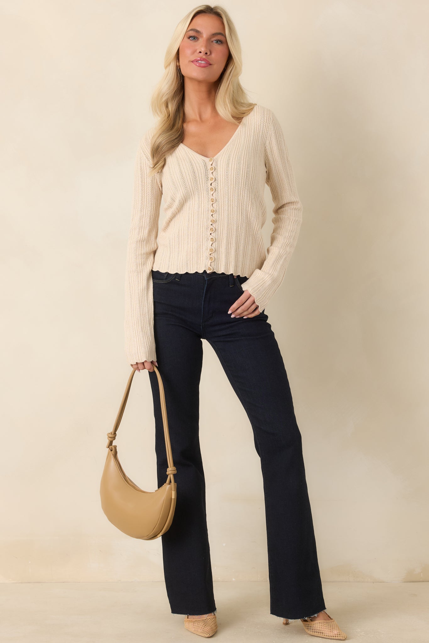 Stretch denim jeans with a close fit through the thighs, classic pockets, and a timeless flared silhouette.