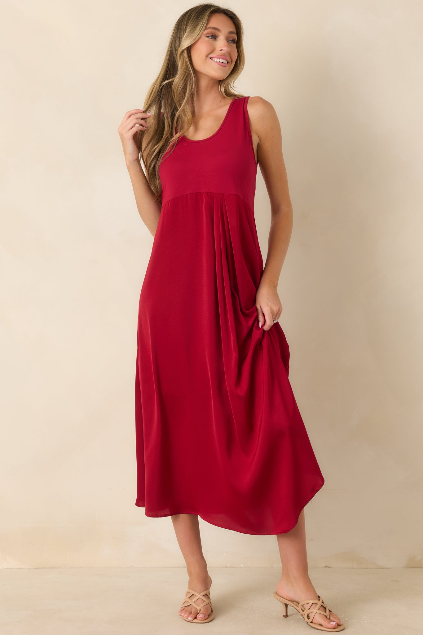 Stretch-knit and satin midi dress designed with a flattering scoop neckline and a softly flowing lined skirt.
