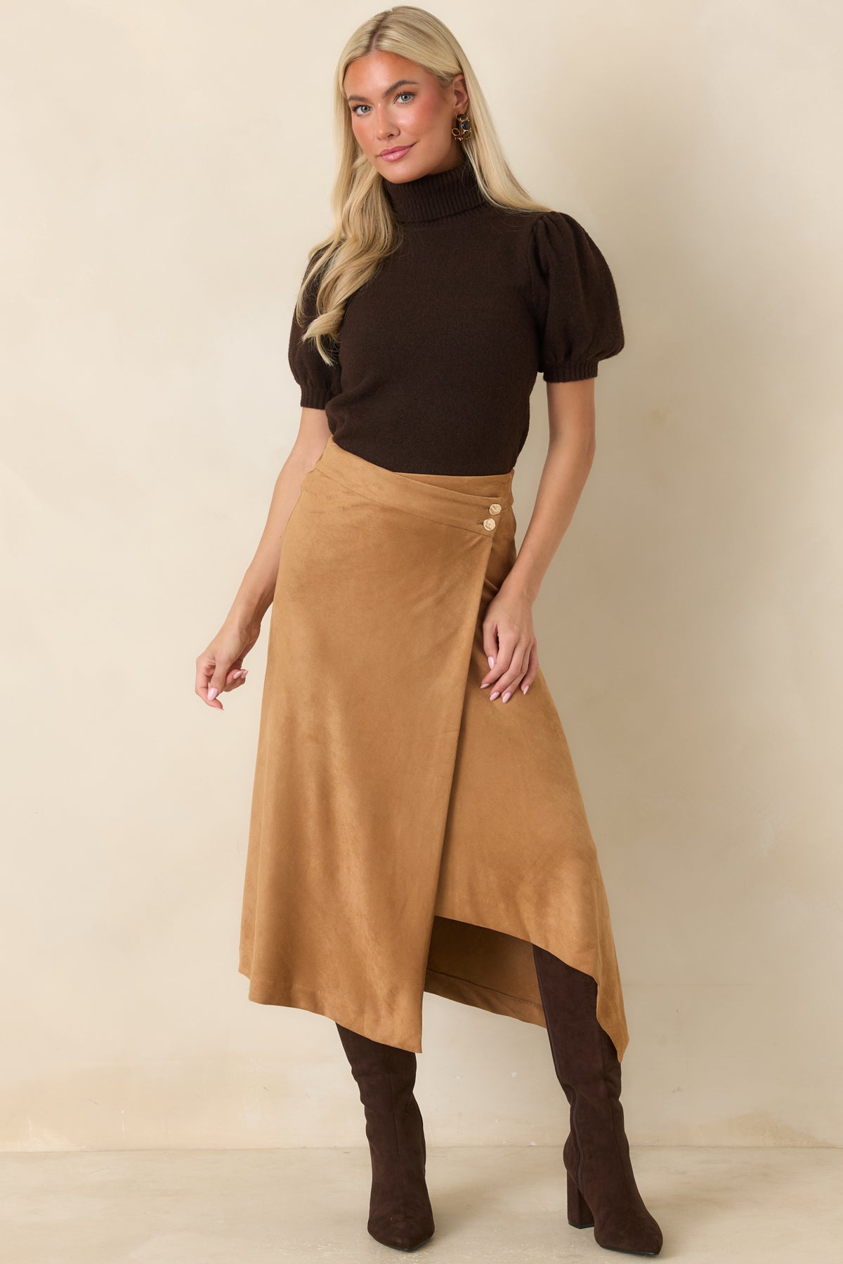 Ribbed turtleneck knit sweater crafted from a soft stretch blend, showcasing subtle puff sleeves, a gently shaped body, and a ribbed hem.