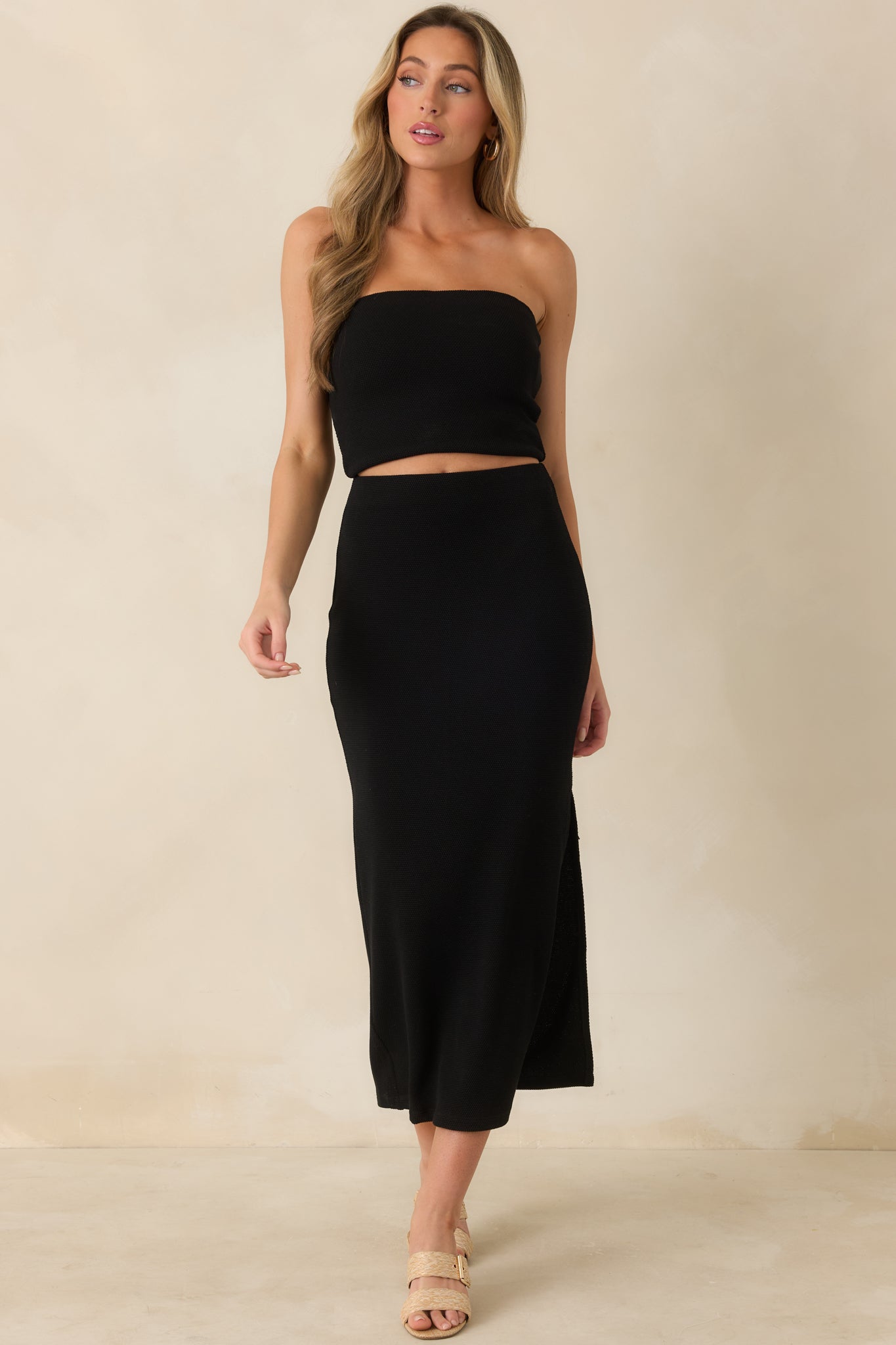 Stretch midi skirt featuring sleek silhouette, soft texture, and easy pull-on waistband.