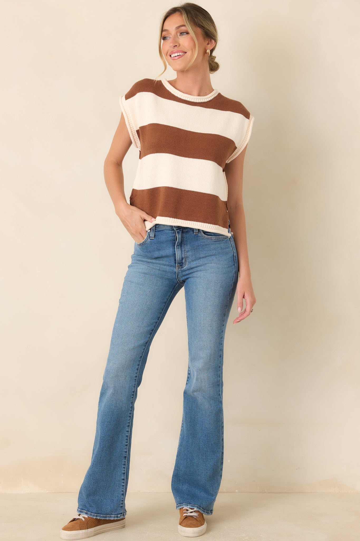 Soft cotton-blend knit top featuring classic horizontal stripes, a round neckline, cap-style sleeves, and a relaxed, polished silhouette.