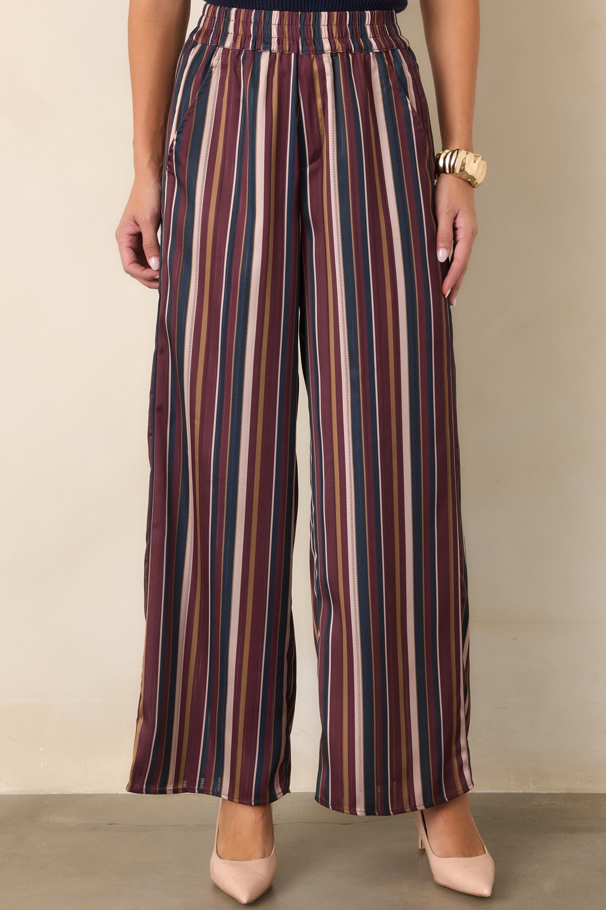 Striped pants featuring the elastic waistband and clean pull-on construction.