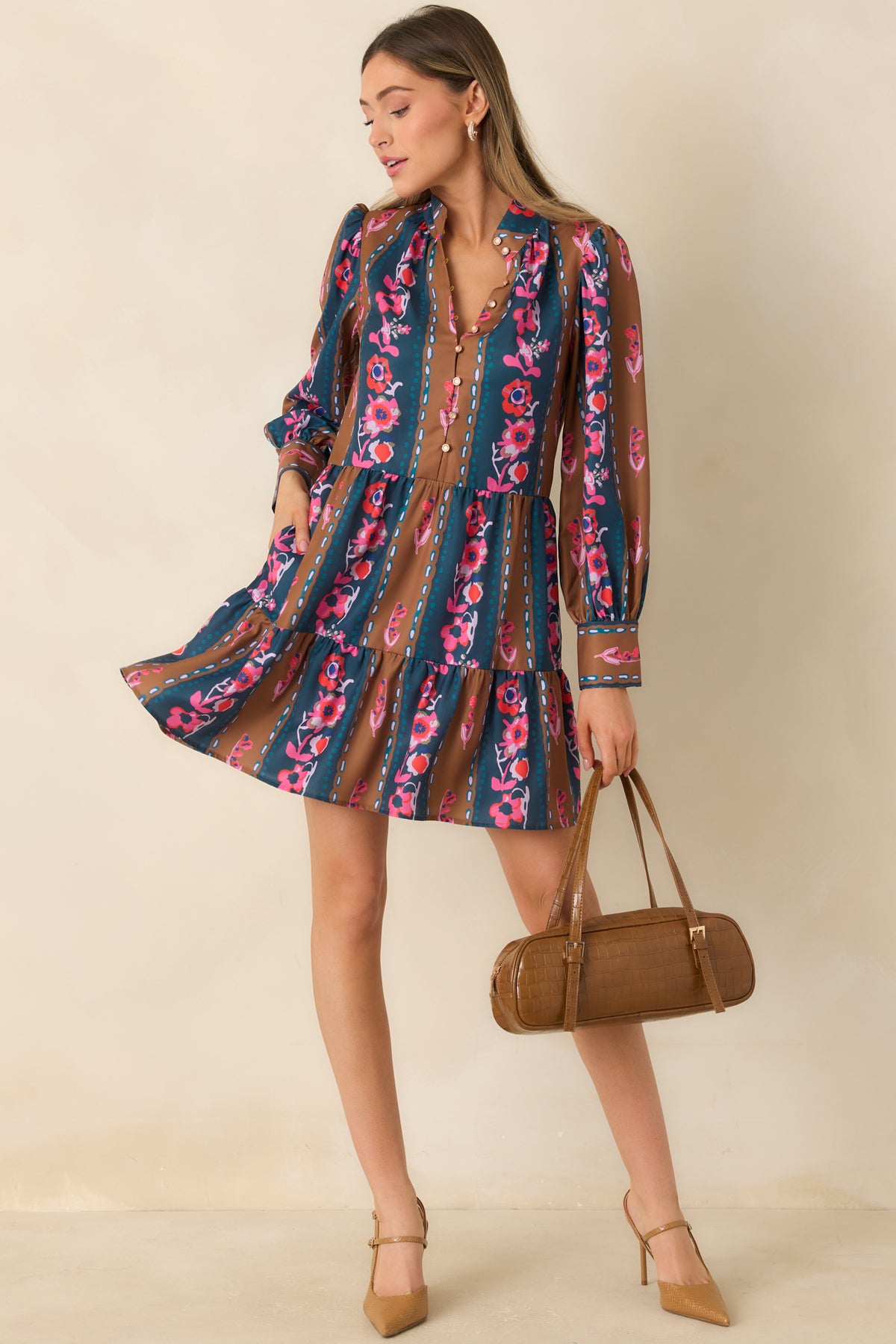 Colorful striped mini dress with a stand collar, gathered shoulders, wide cuffs, and functional side pockets.