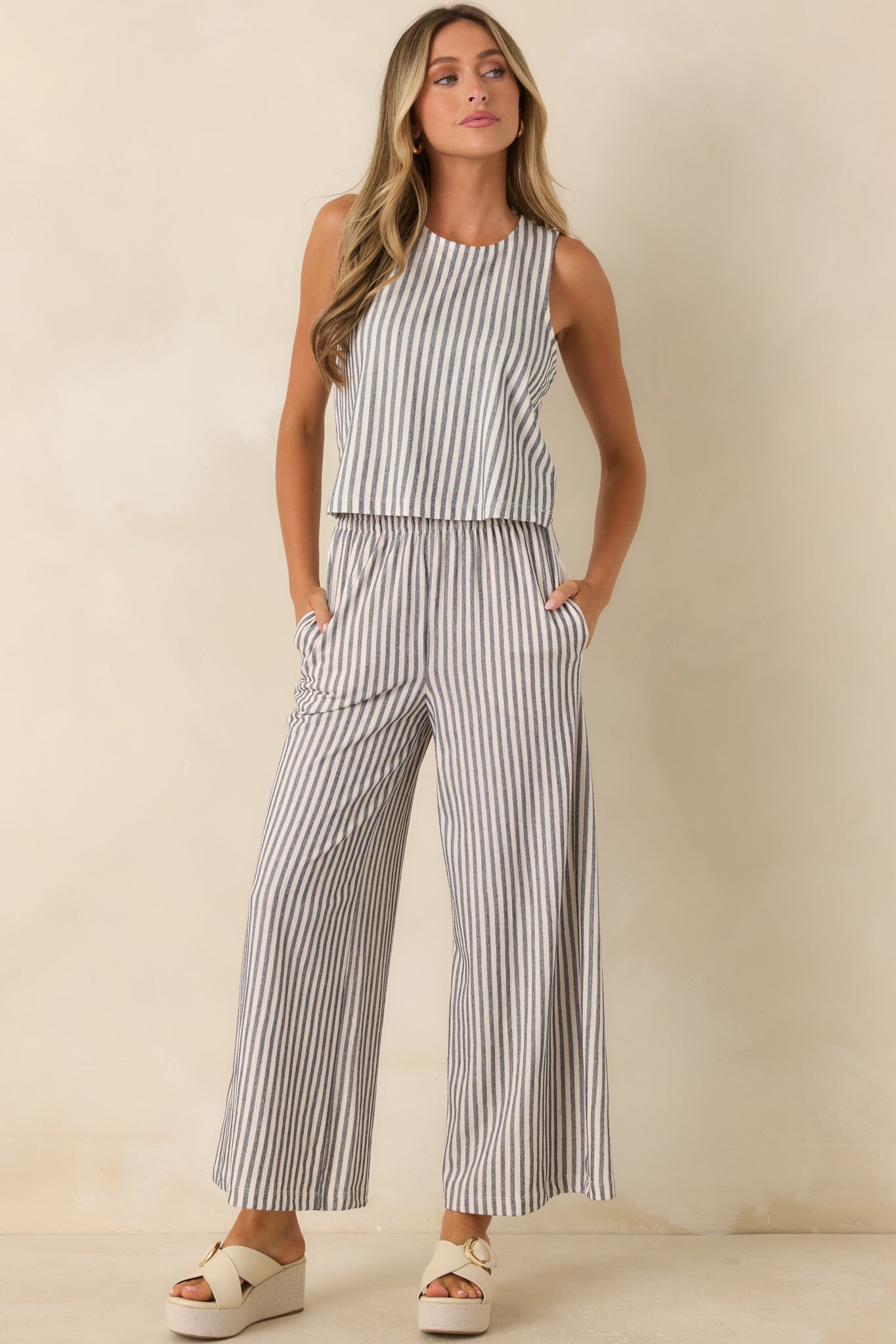 Striped knit top designed with a lightweight feel, sleeveless shape, and effortless everyday style.
