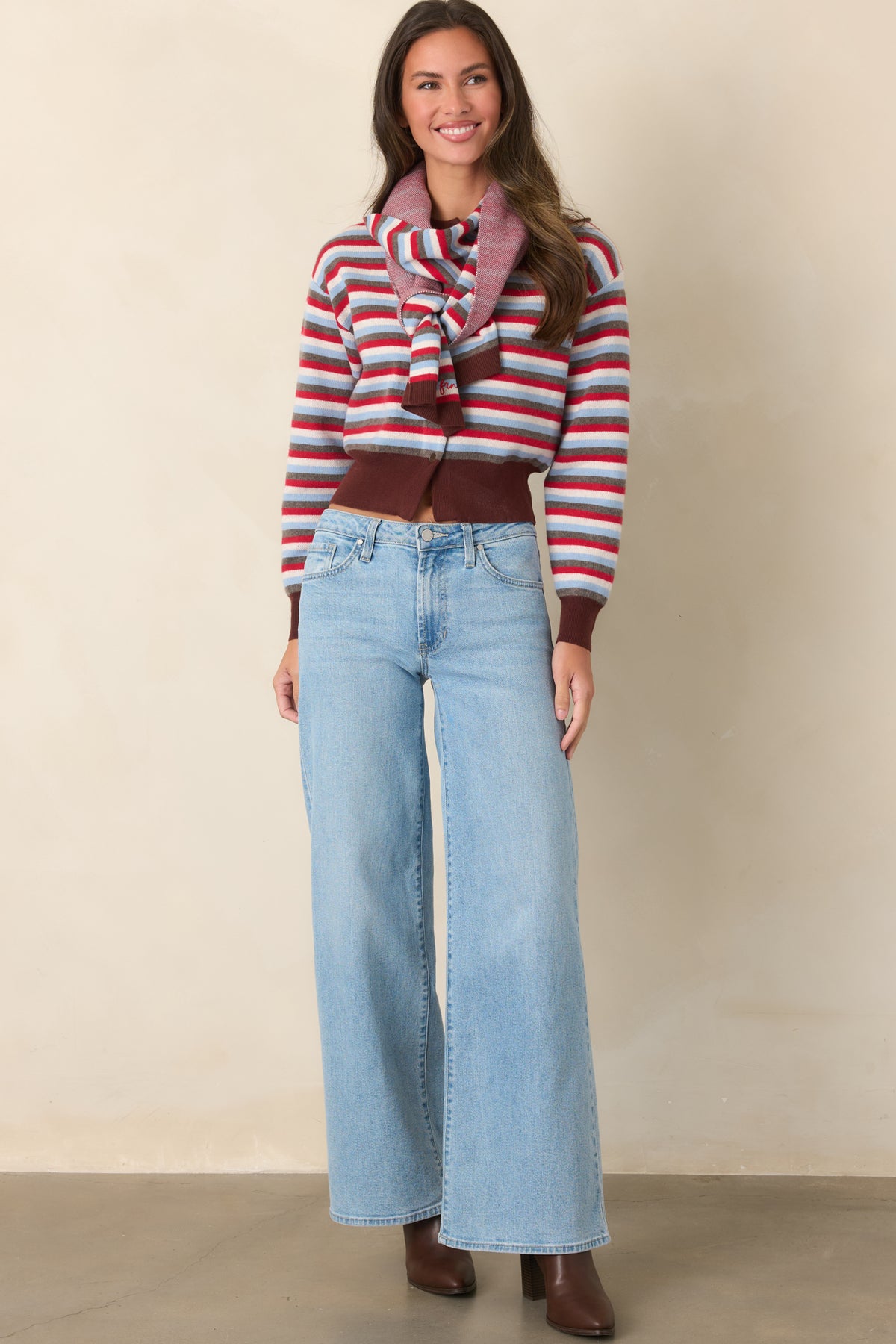Long sleeves and dropped shoulders give this striped cardigan an easy shape finished with rich brown ribbing.