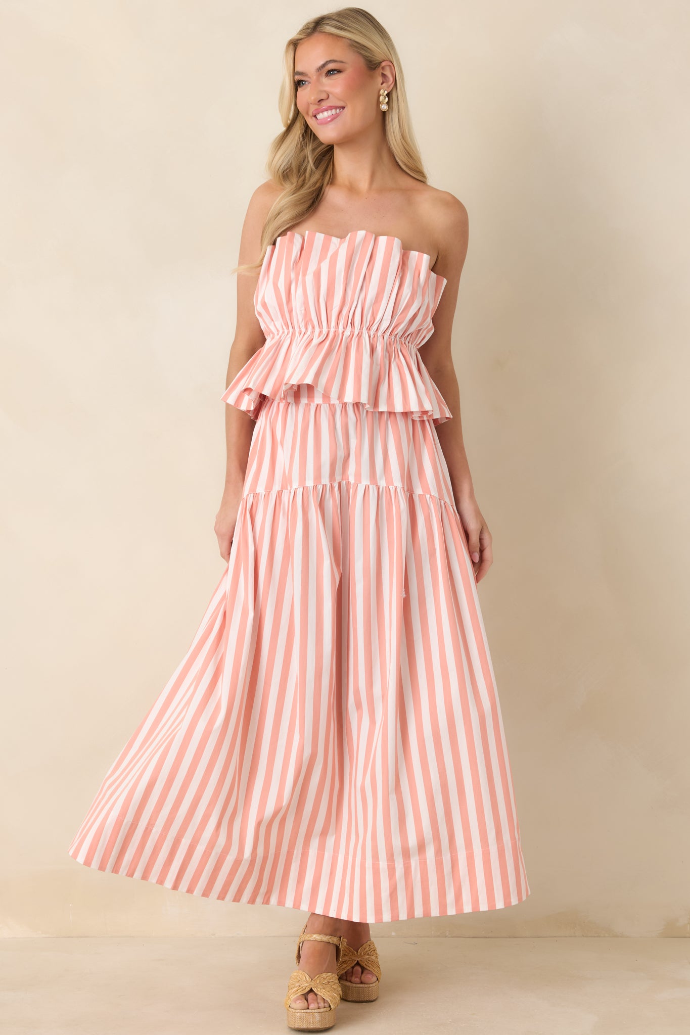 Striped maxi skirt featuring a defined waistband and softly layered tiers that create graceful movement.