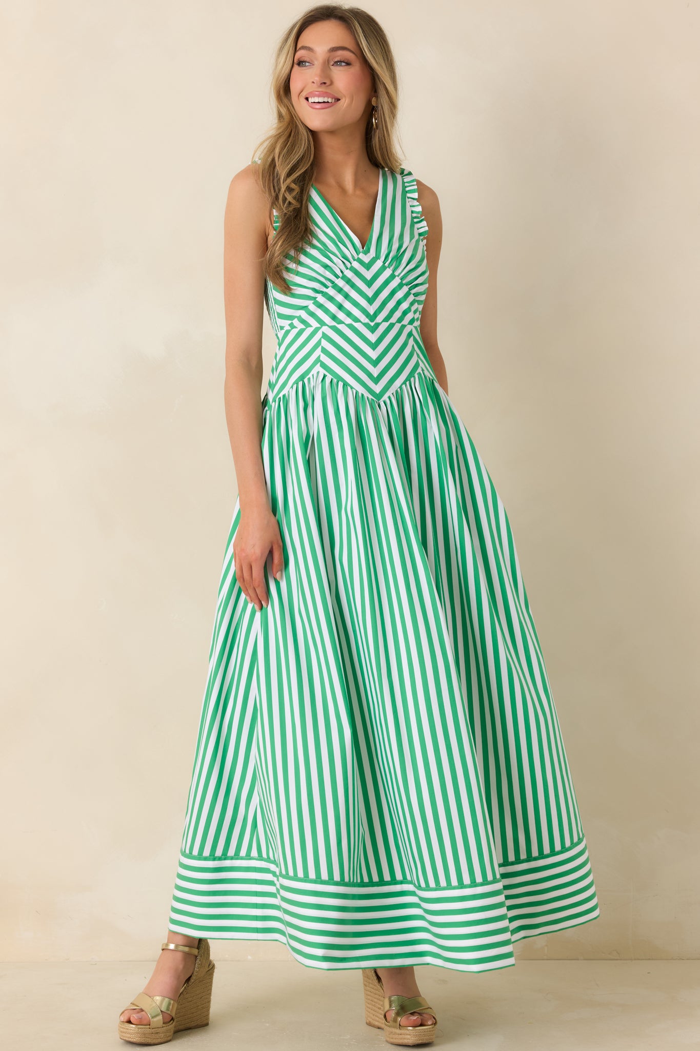 Striped midi dress with mixed vertical and chevron pattern and structured bodice.