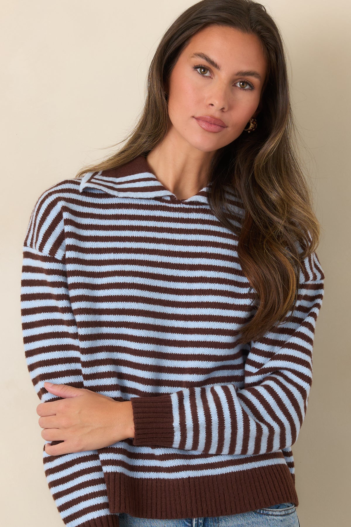 Striped top highlighting the polo-style collar and contrasting chocolate brown ribbed trim.
