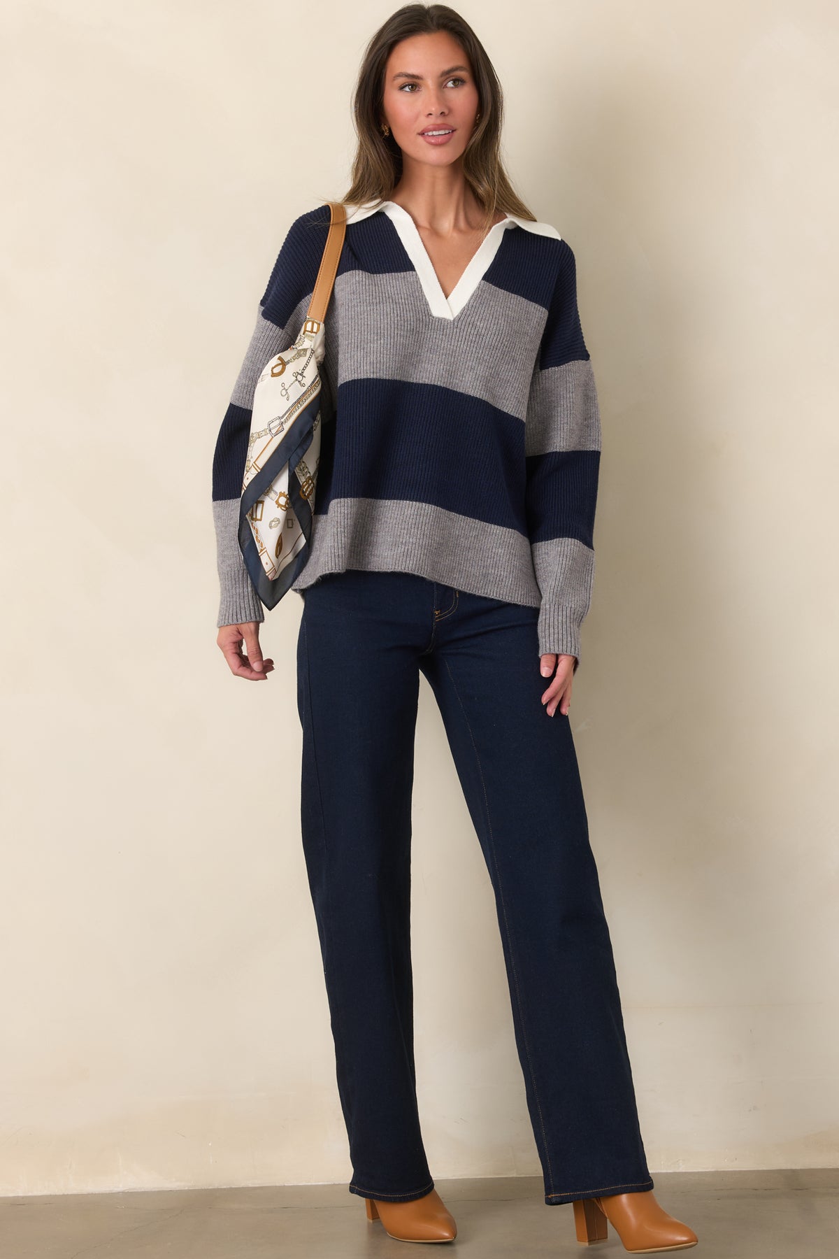 Striped ribbed top showcasing the ivory collar and comfortable hip-length silhouette.