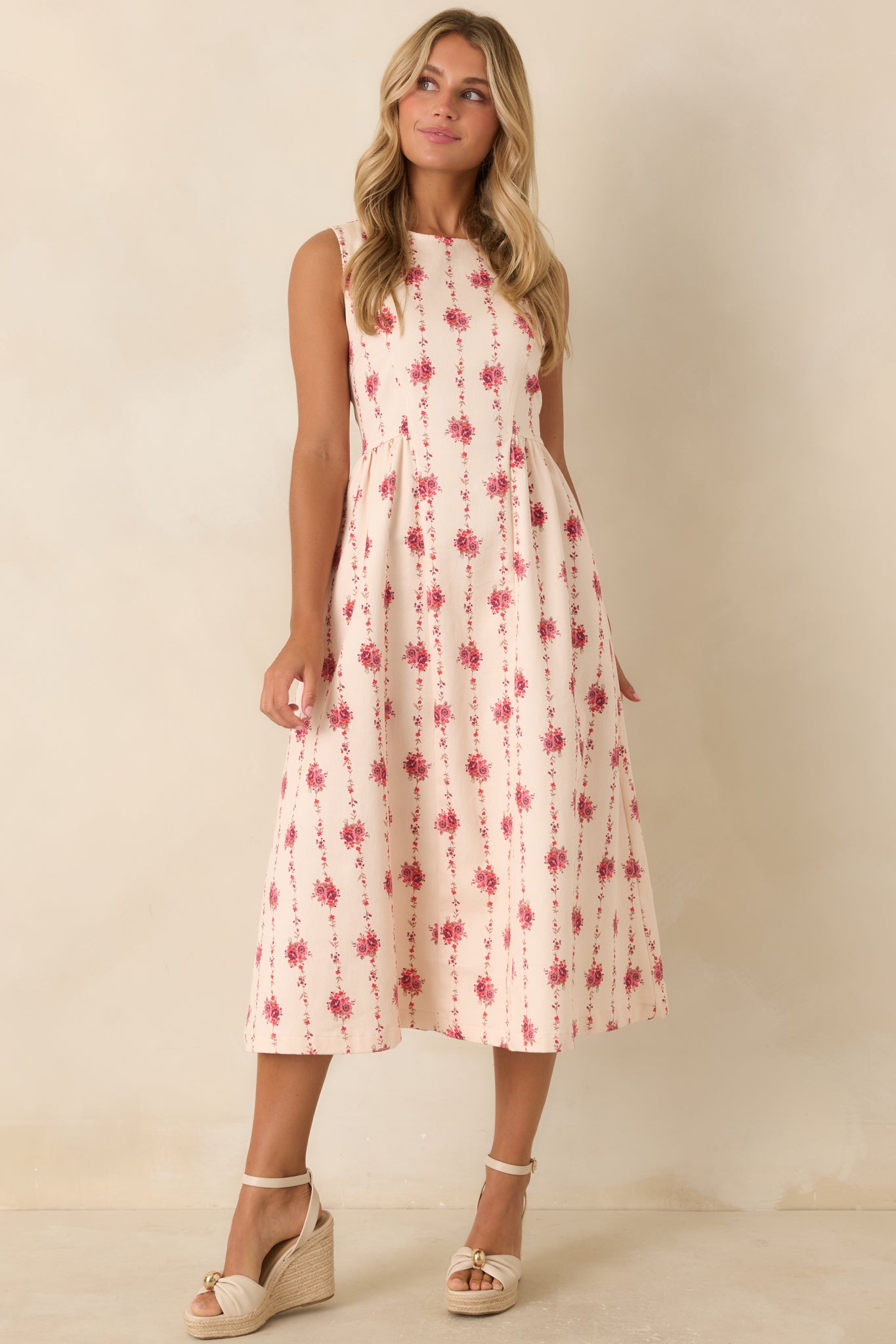 Structured cotton blend midi dress with a fitted bodice, flowing skirt, elongated floral stripe pattern, and concealed zipper.