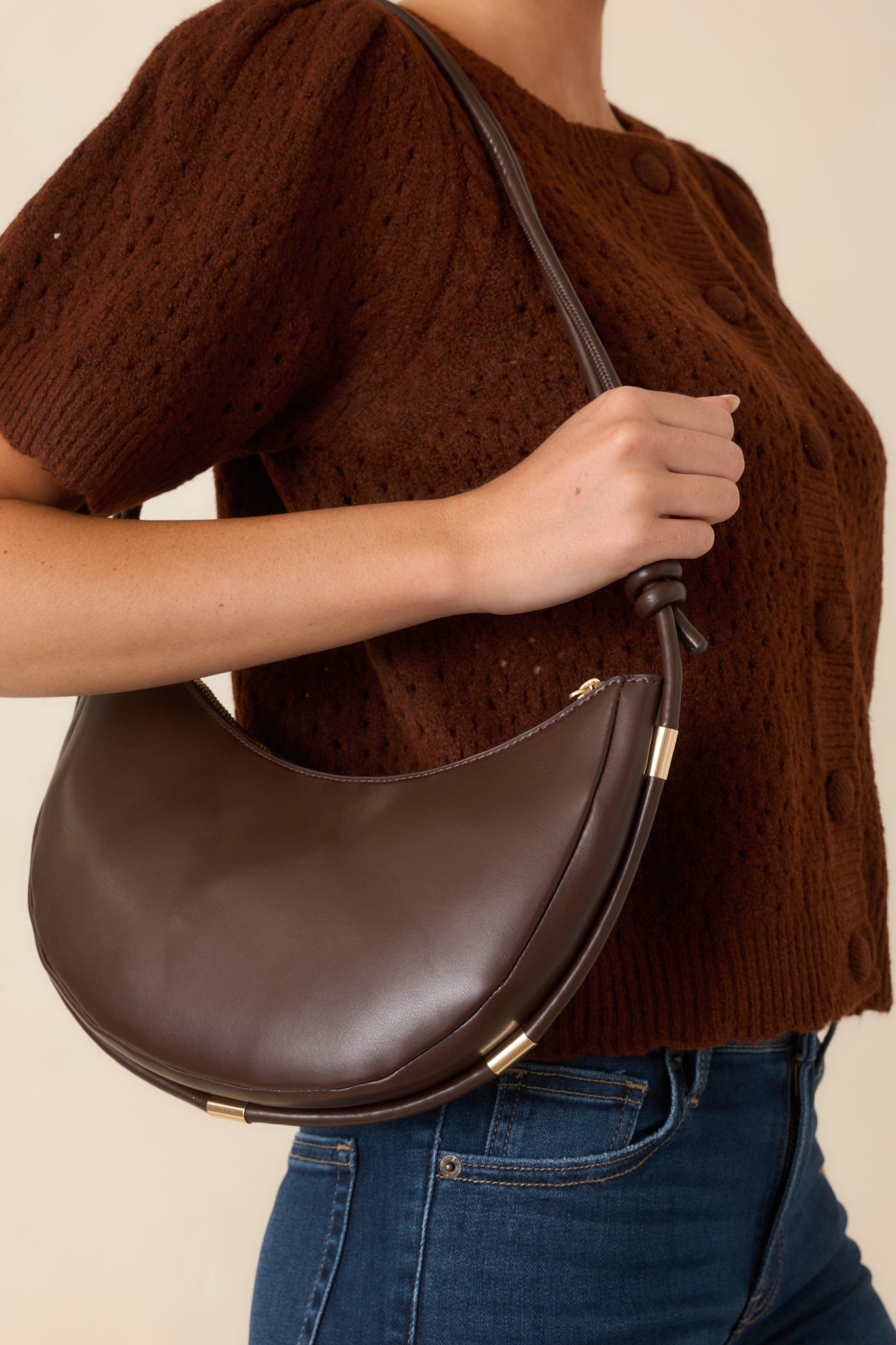 Structured handbag showcasing a spacious silhouette, secure zip-top closure, and refined hardware detailing.