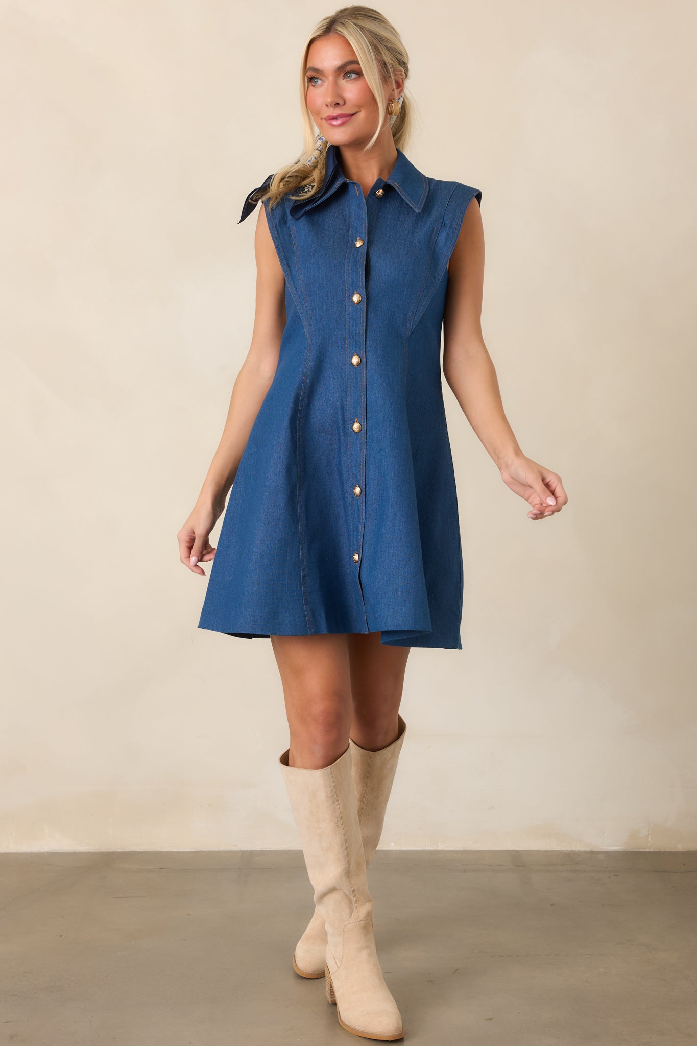 Cotton-blend mini dress with stretch featuring a structured bodice, pointed neckline, sleeveless cut, and fitted waist that flows into a flared skirt.