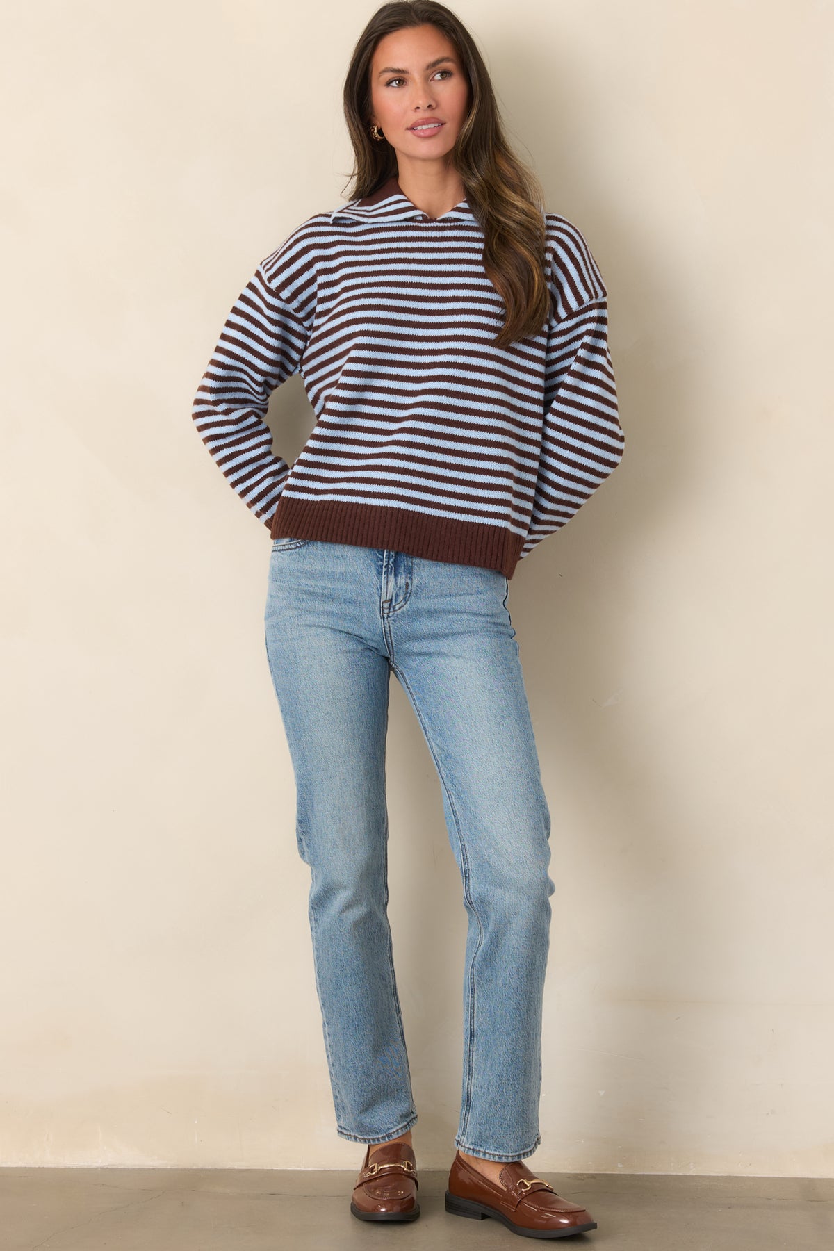 Structured stretch denim jeans with a close-fitting high-rise waist and full-length straight legs.

