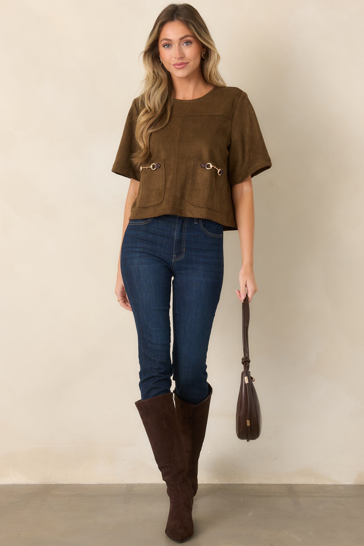 Suede-like short-sleeve top showcasing oversized front patch pockets with distinctive horsebit-inspired hardware.