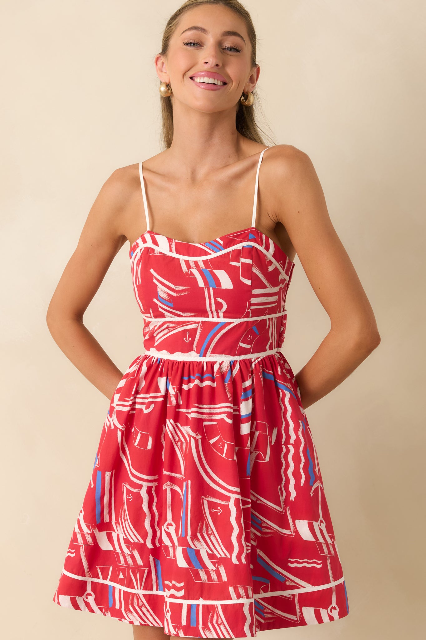Detailed view of the sweetheart neckline, adjustable spaghetti straps, and contrast piping along the bodice.