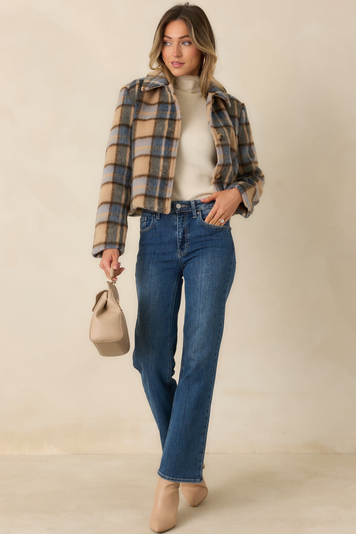 Tailored cropped jacket with a soft brushed finish in toffee, muted blue, and charcoal tones.