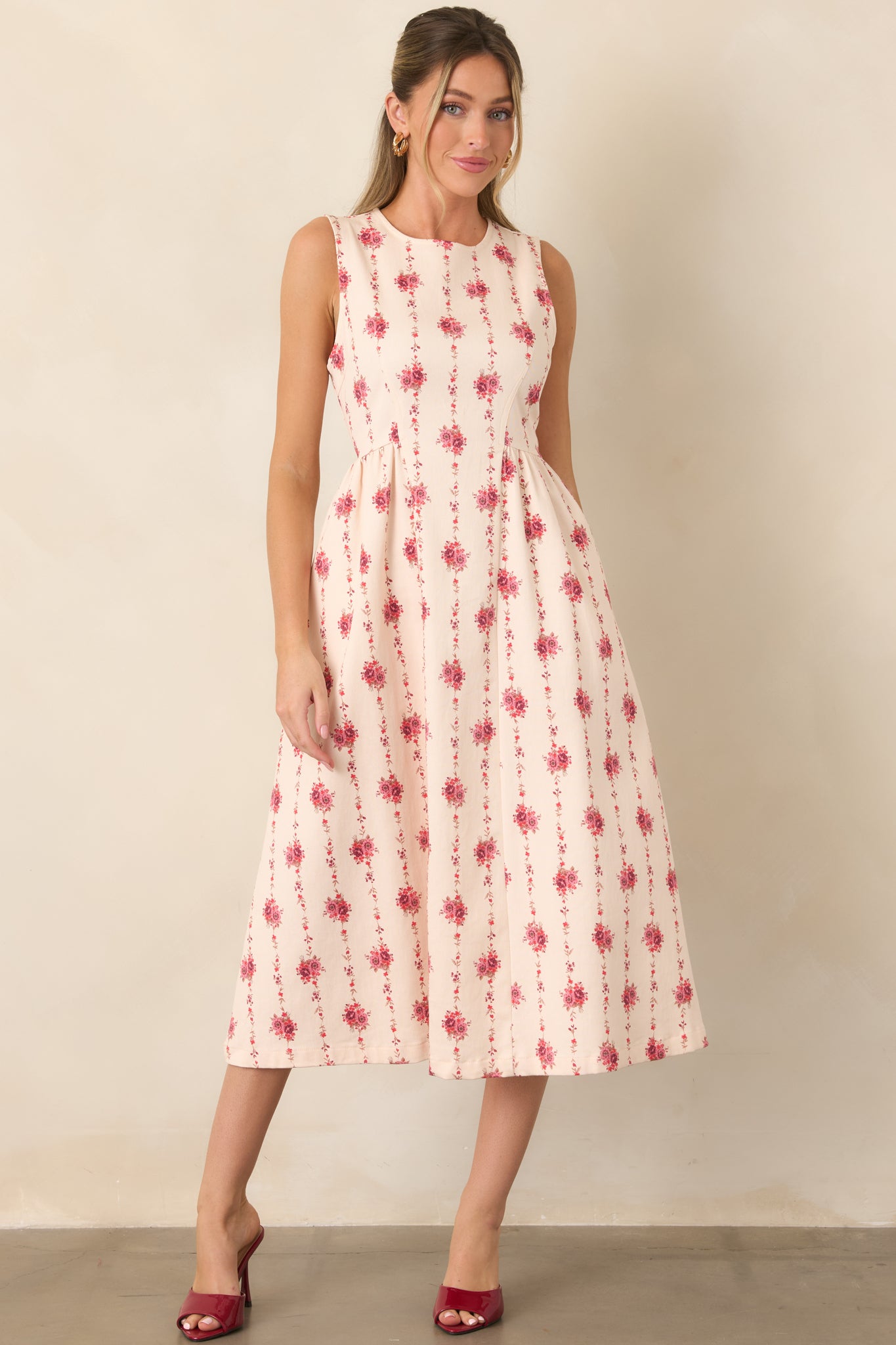 Tailored floral stripe dress featuring a sculpted princess-seam bodice, fitted waist, and graceful midi-length skirt.