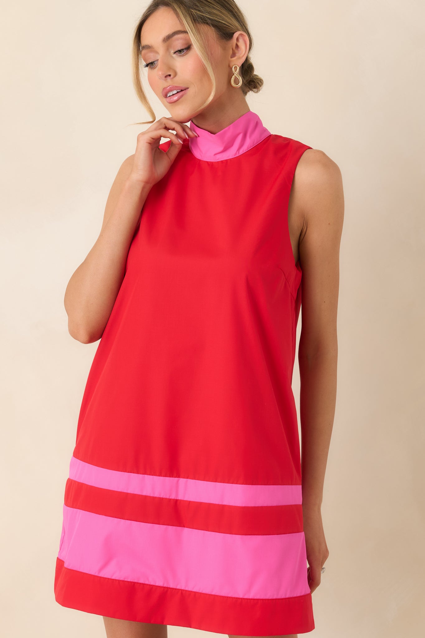 Focus on the tailored shift-style body and subtle structure, showing the relaxed silhouette and smooth fabric.