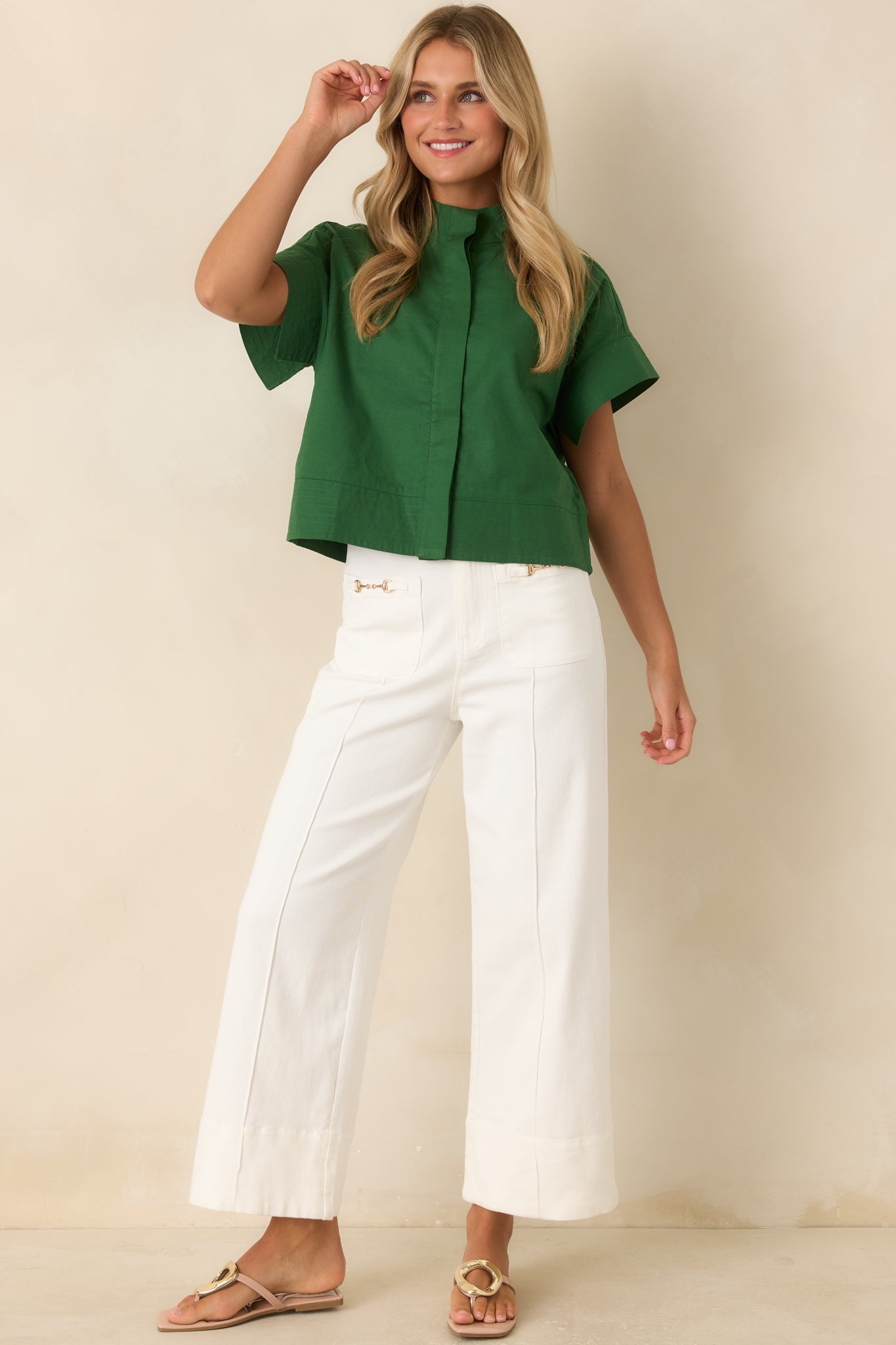 Tailored wide leg pants designed with a stretchy cotton blend, front pleats, high waist, and clean elongated silhouette.
