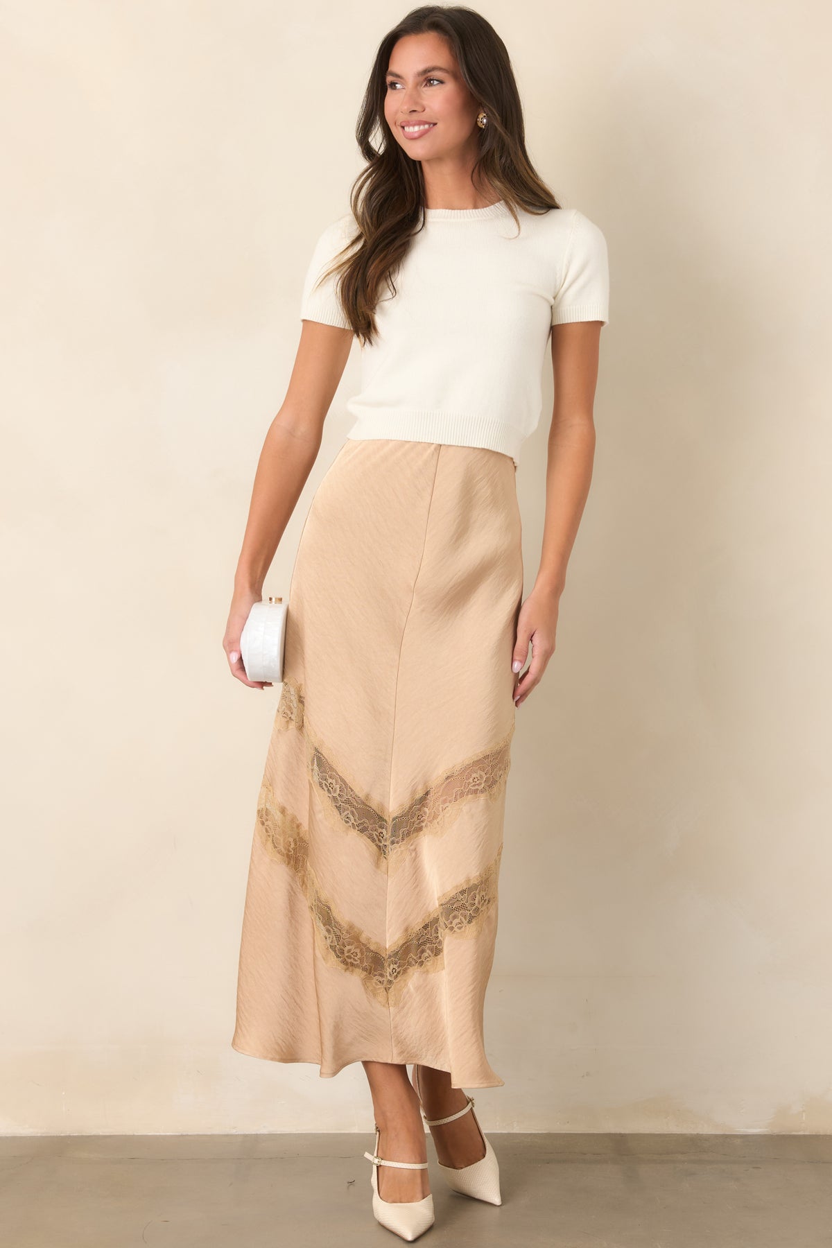 Tan skirt with an easy drape through the body and clean silhouette.