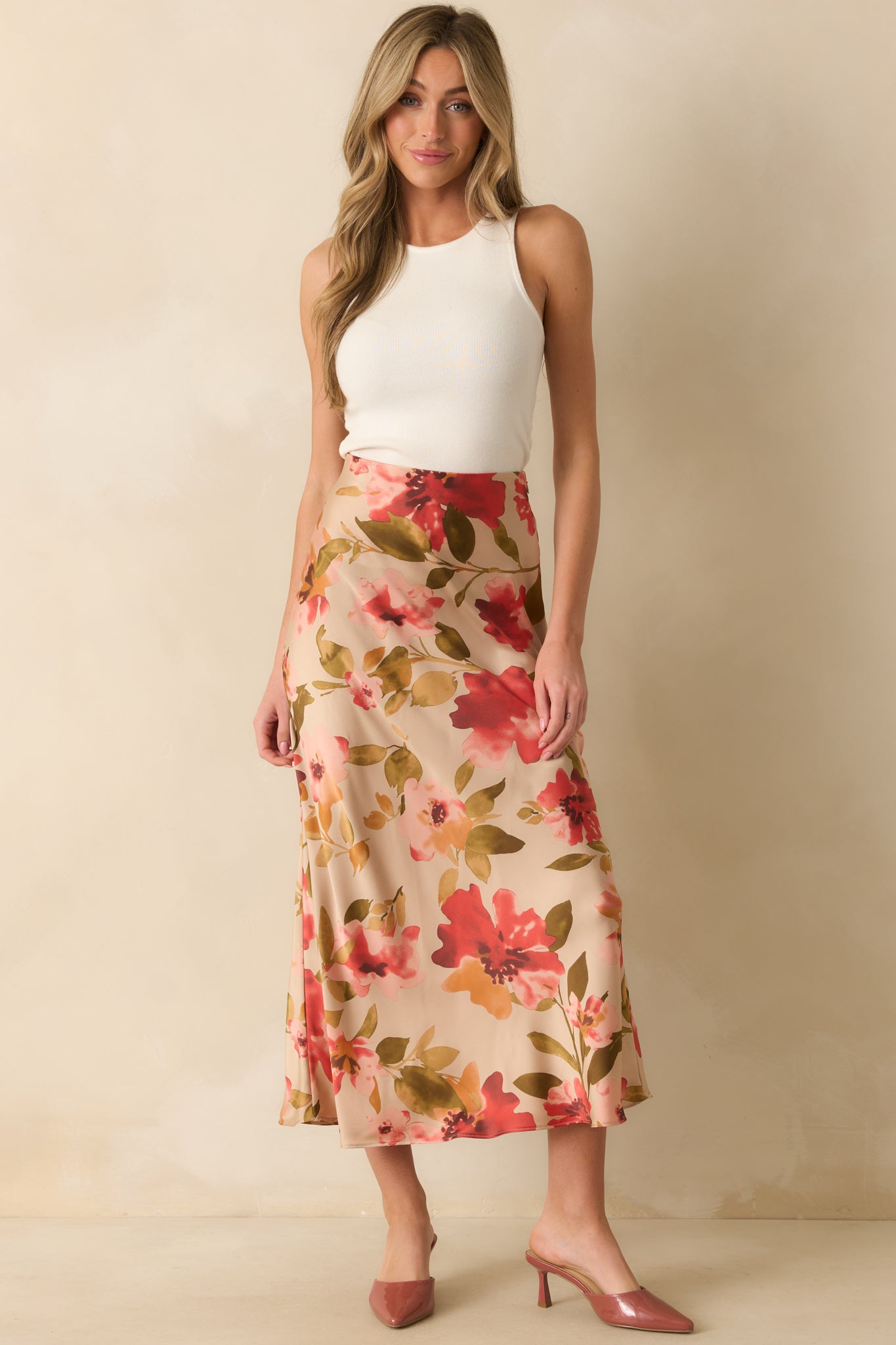 Tan maxi skirt with high-rise waistband, soft multicolor pink floral print, and a flowing floor-length silhouette.