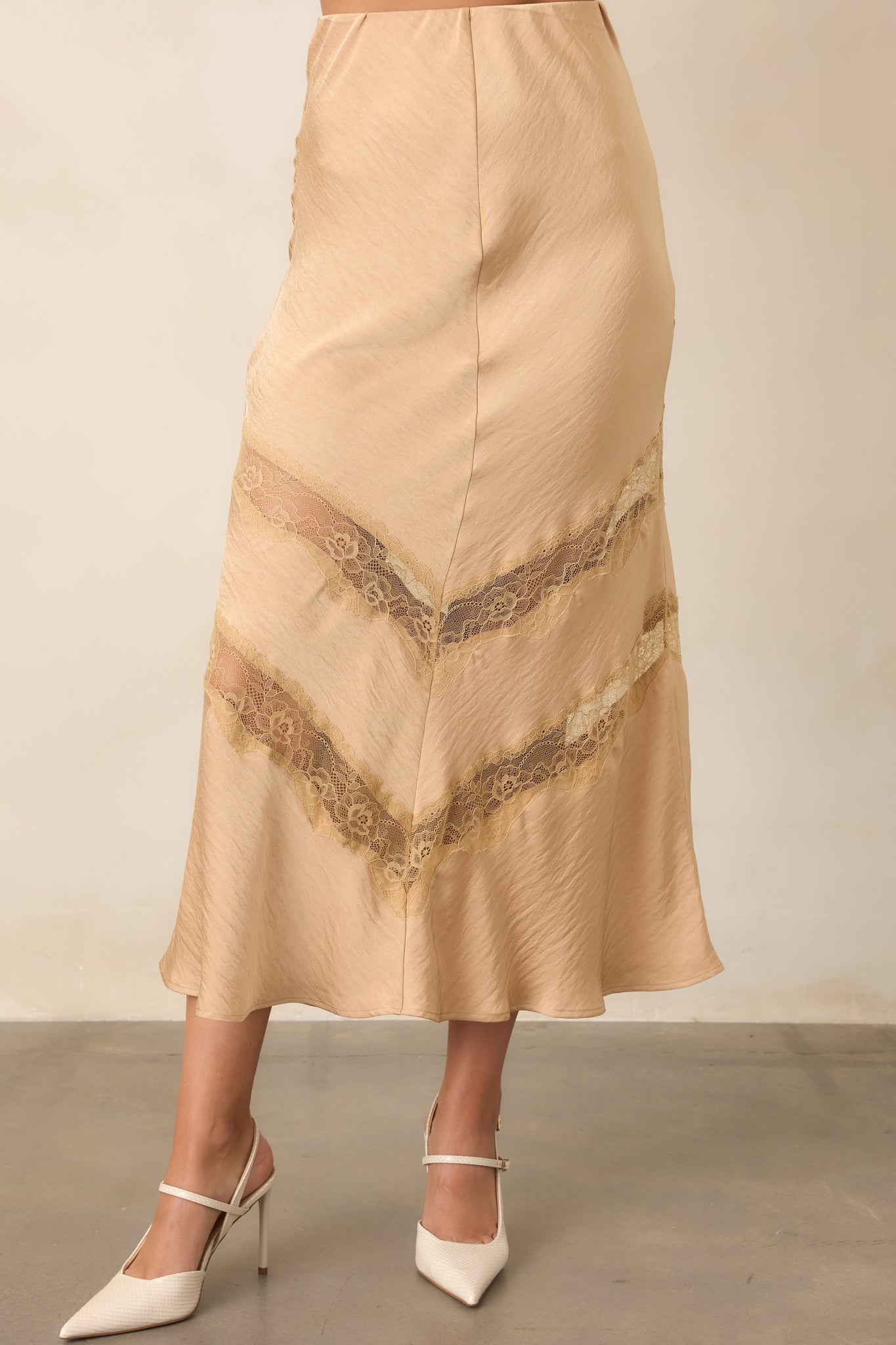 Close view of the skirt highlighting its fitted waist and softly crinkled surface.