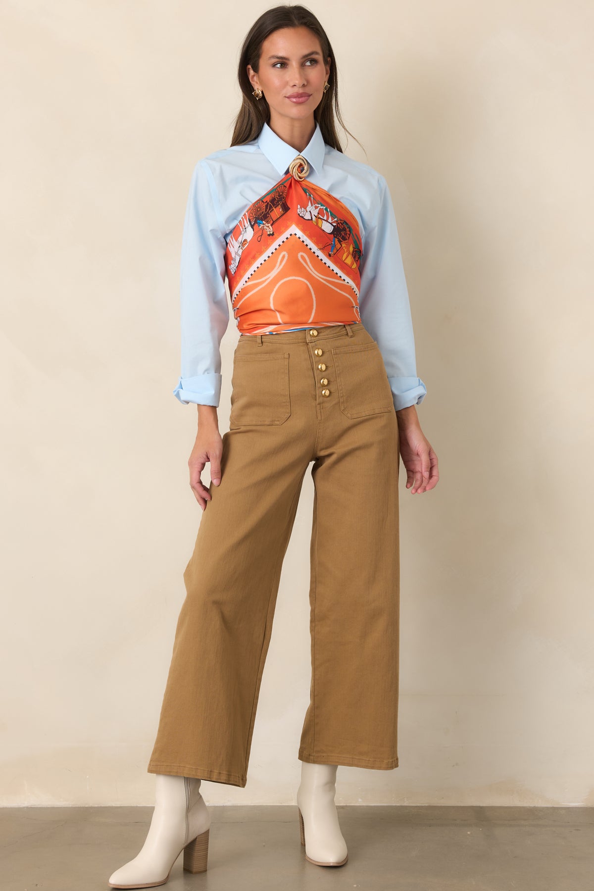 Warm tan stretch cotton pants with a high rise, gold-tone button front, and cropped wide-leg silhouette.
