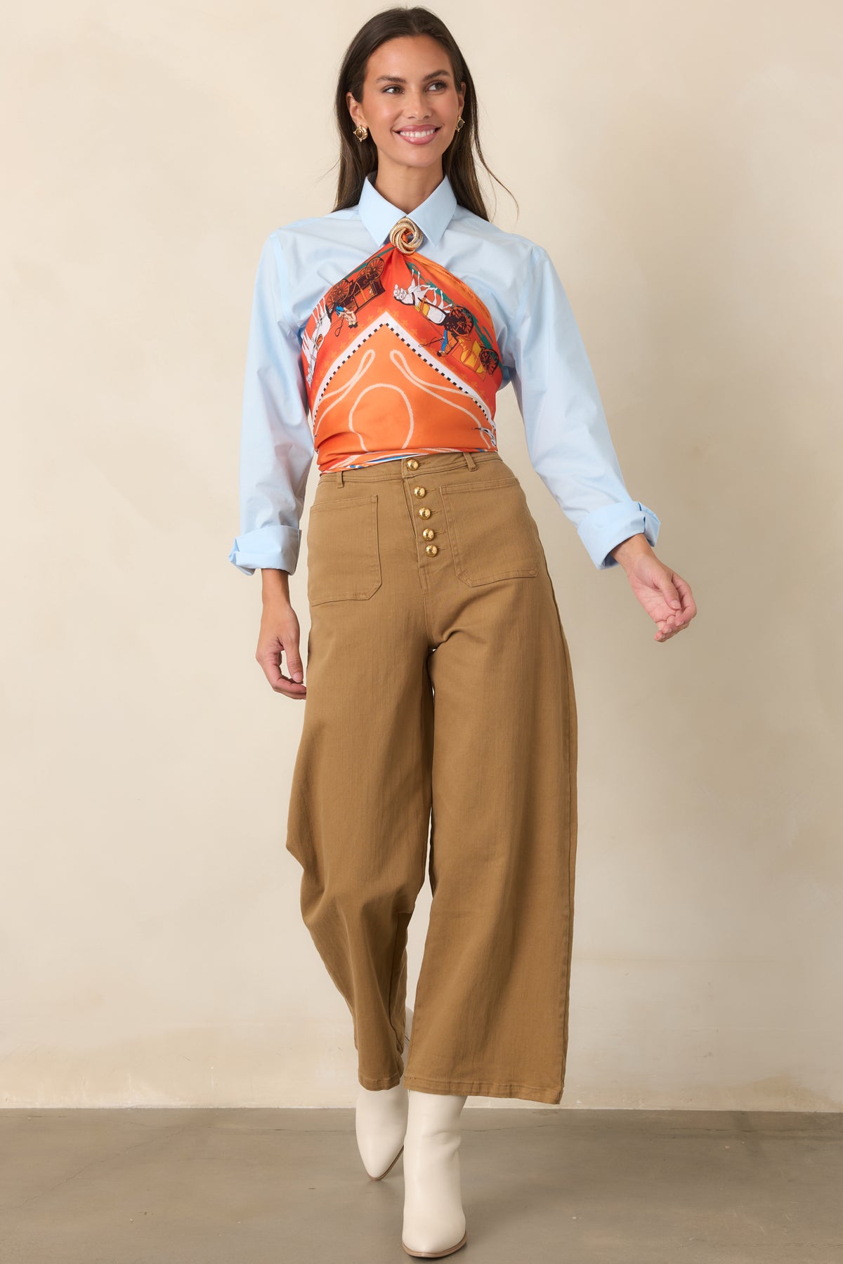 Stretch cotton pants in warm tan with utility-inspired patch pockets and a modern cropped wide-leg shape.