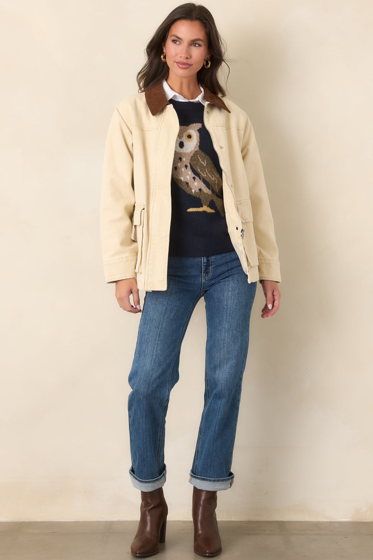 Taupe cotton utility jacket with a straight-cut body, full-length sleeves, and a combination zip-and-snap front closure.