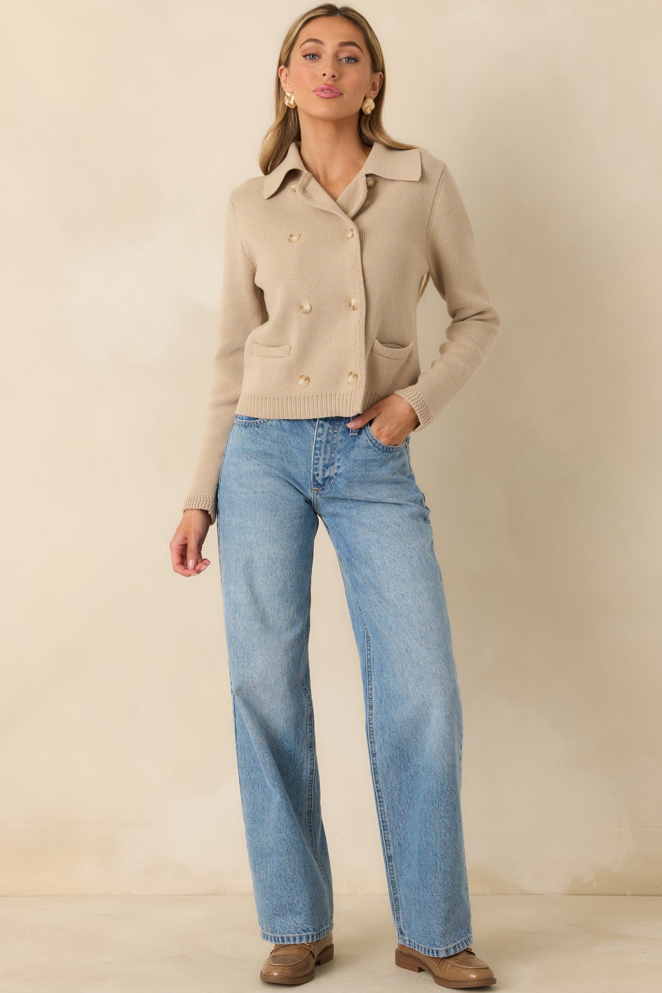 Taupe cotton knit cardigan with a double-breasted button front, classic collar neckline, long sleeves, and a slightly tailored silhouette.