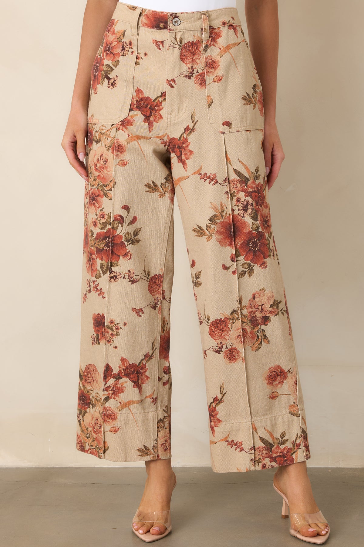 Taupe cotton pants displaying the contrasting rust floral pattern and clean cropped wide-leg shape.