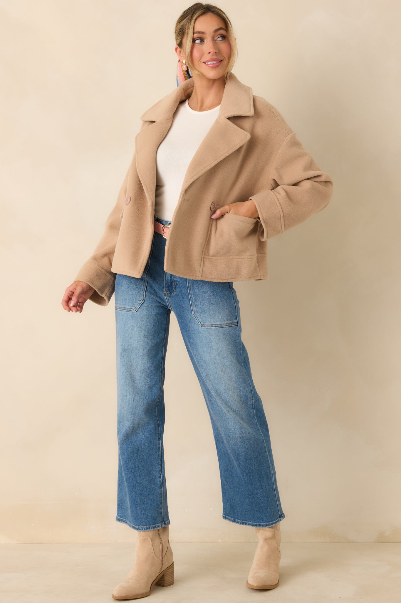 Soft taupe felted jacket with a structured fit, notched collar, and classic double-breasted closure.