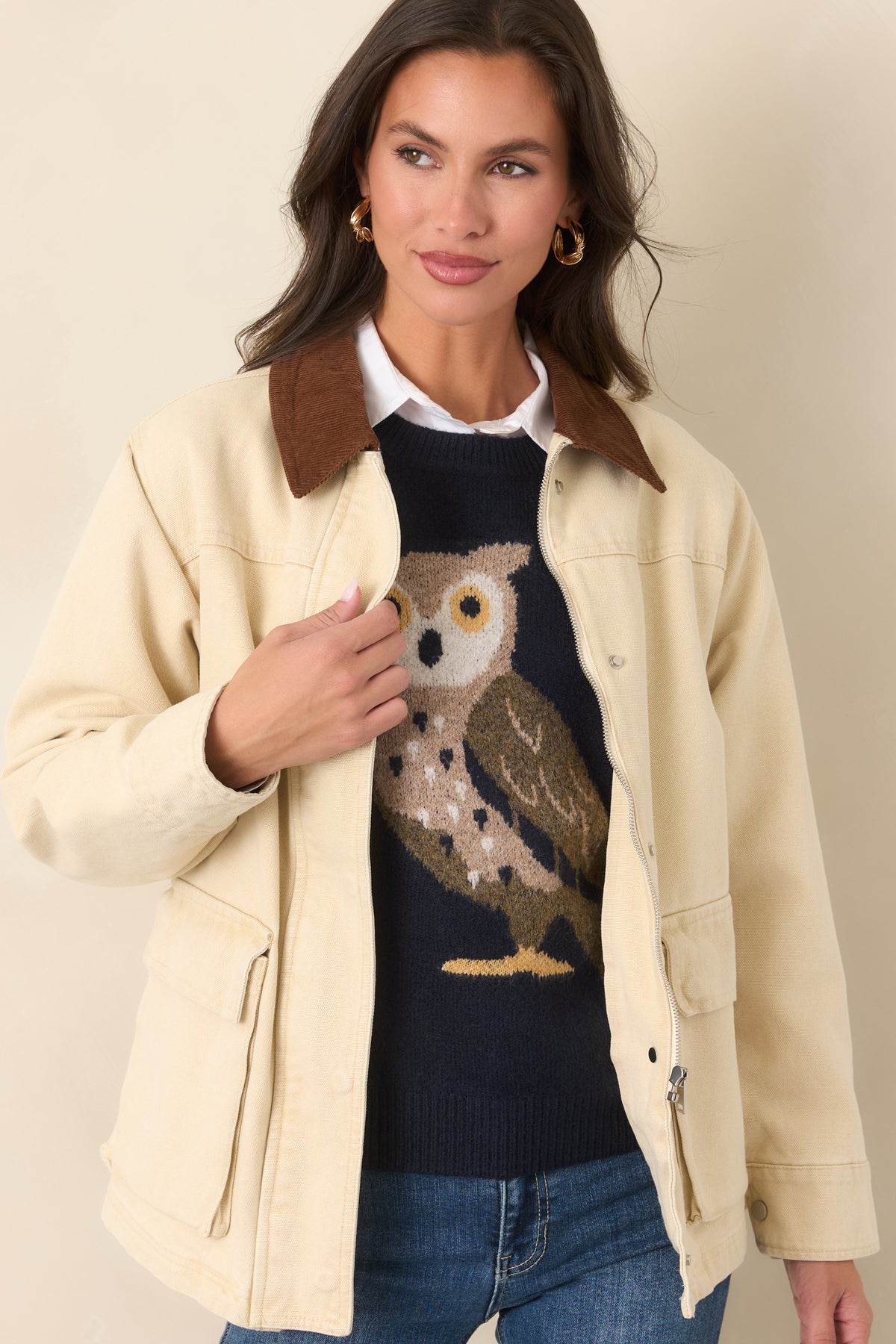 Taupe cotton jacket featuring functional flap pockets at the hips and a sturdy zip-front design.