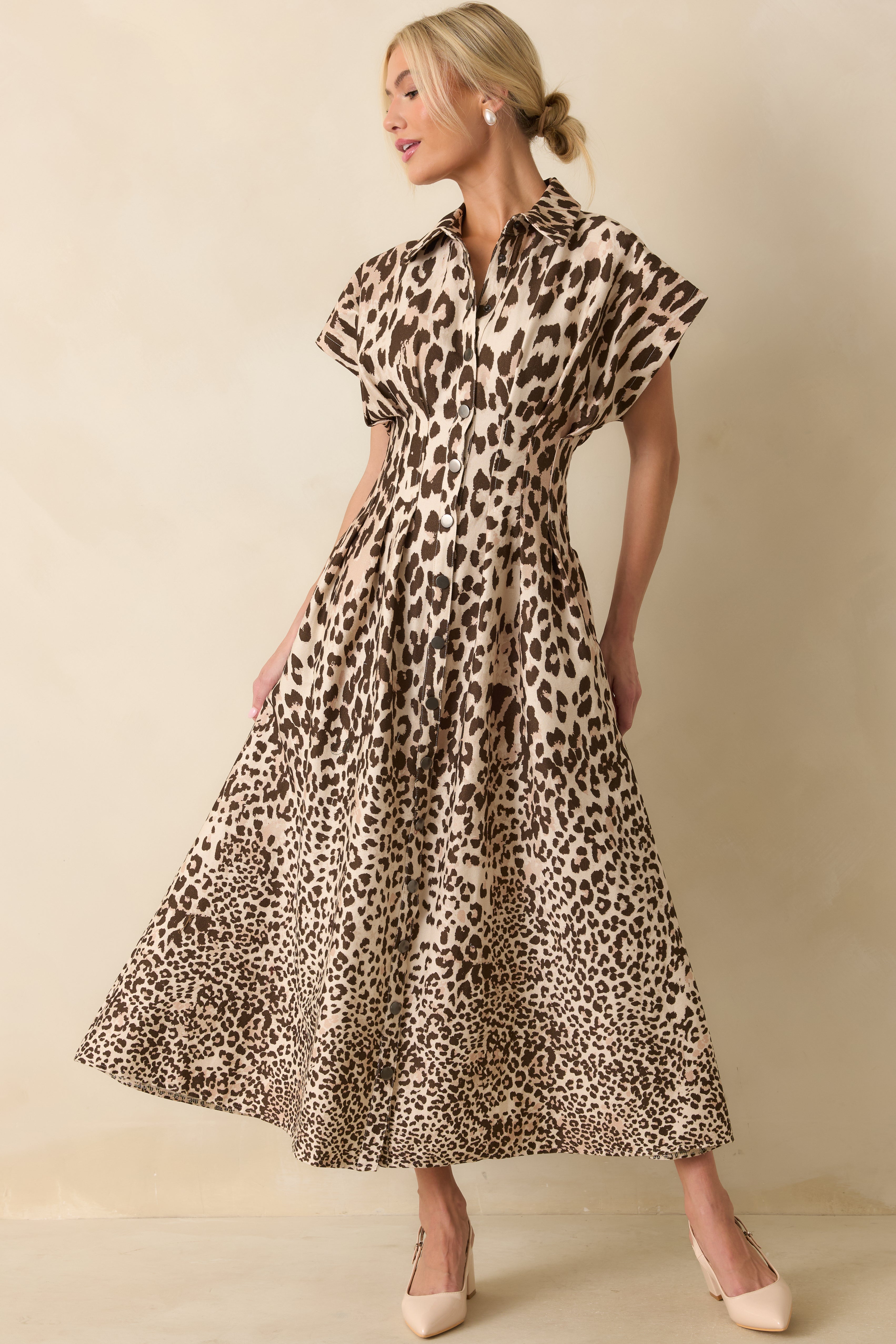Taupe leopard print maxi dress showcasing the defined waist seam and flowing full-length silhouette in a denim-like twill texture.