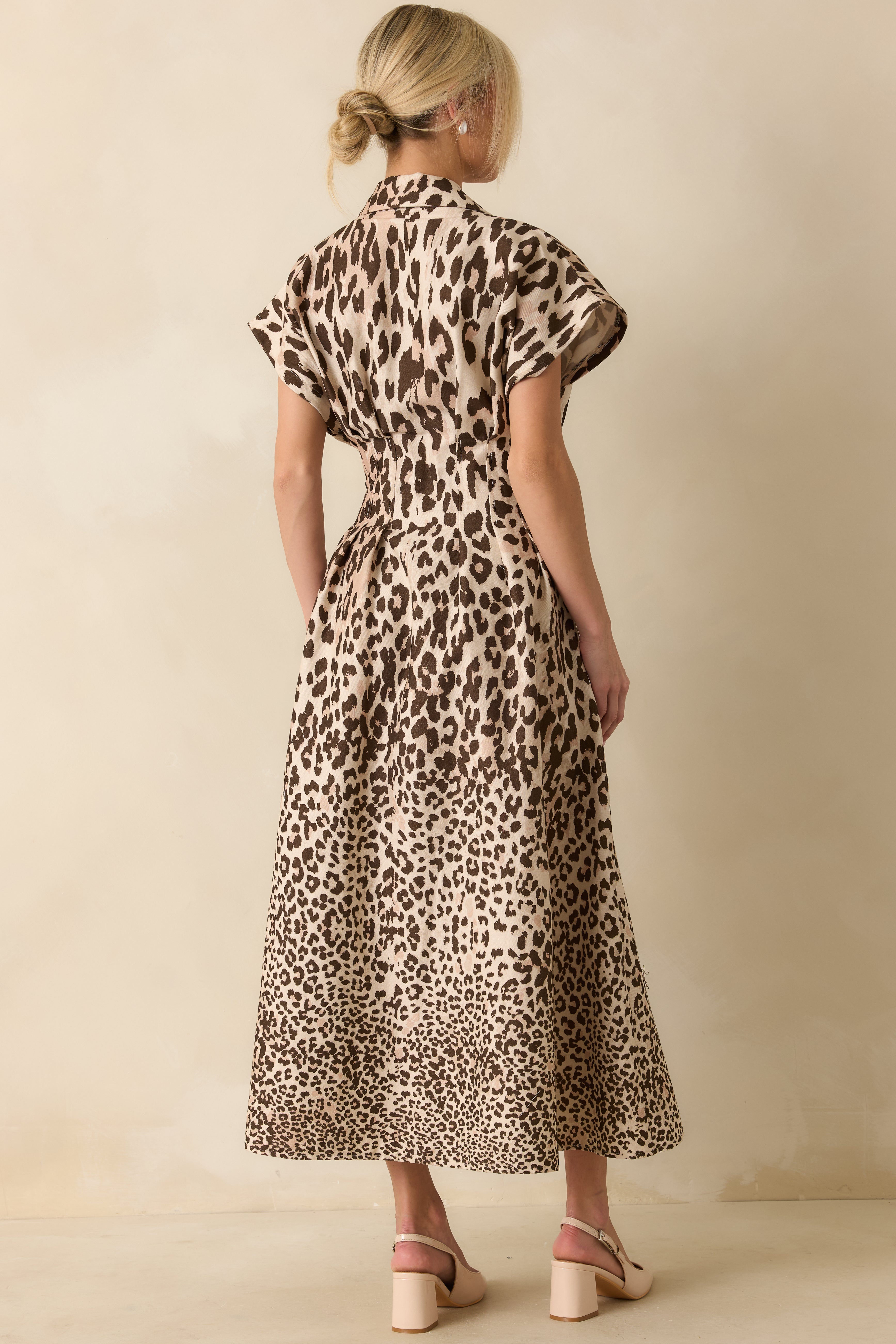 Rear view of the taupe leopard print maxi dress showing the defined waist seam and smooth structured finish.