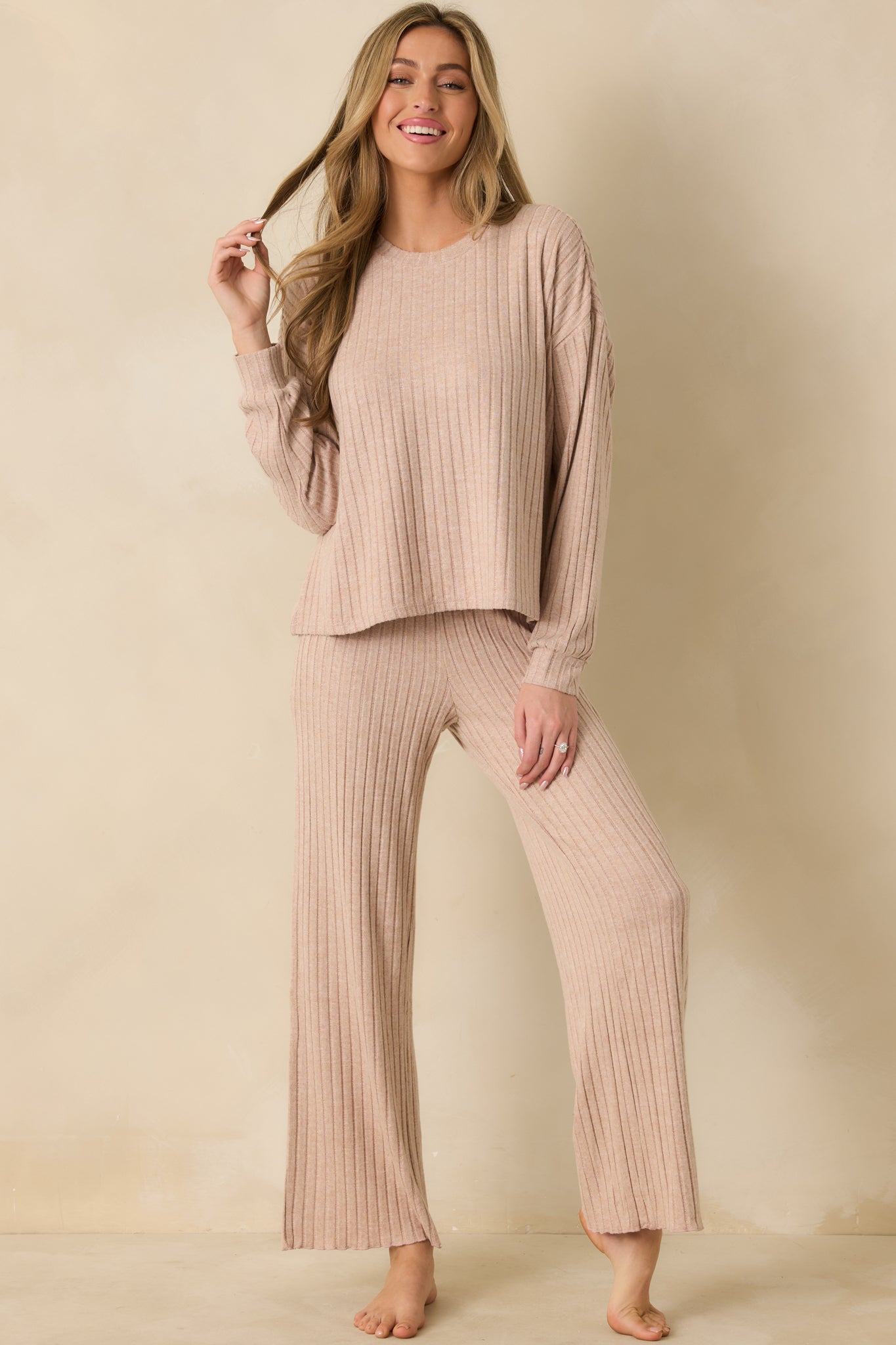 Taupe long sleeve top showing relaxed fit with crew neckline and dropped shoulders.