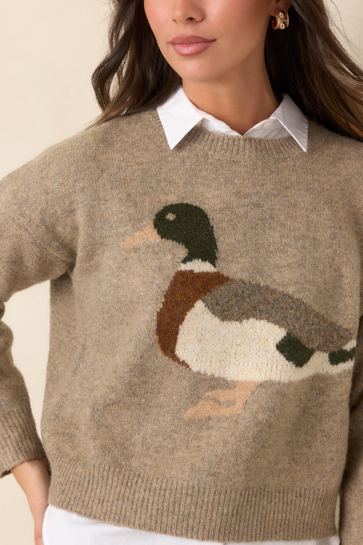 Close-up highlights the mallard motif's earthy colors and the textured heathered taupe knit.