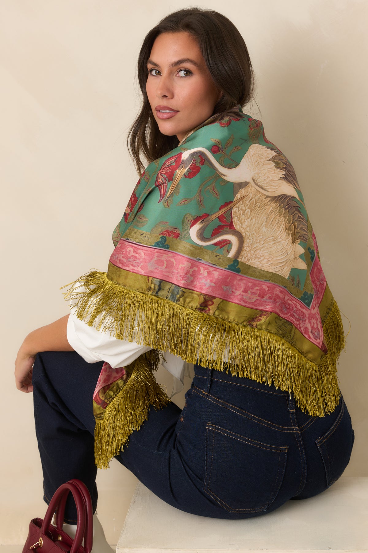 Rich teal item featuring cream and tan cranes, red florals, olive foliage, and ornate pink and olive borders.