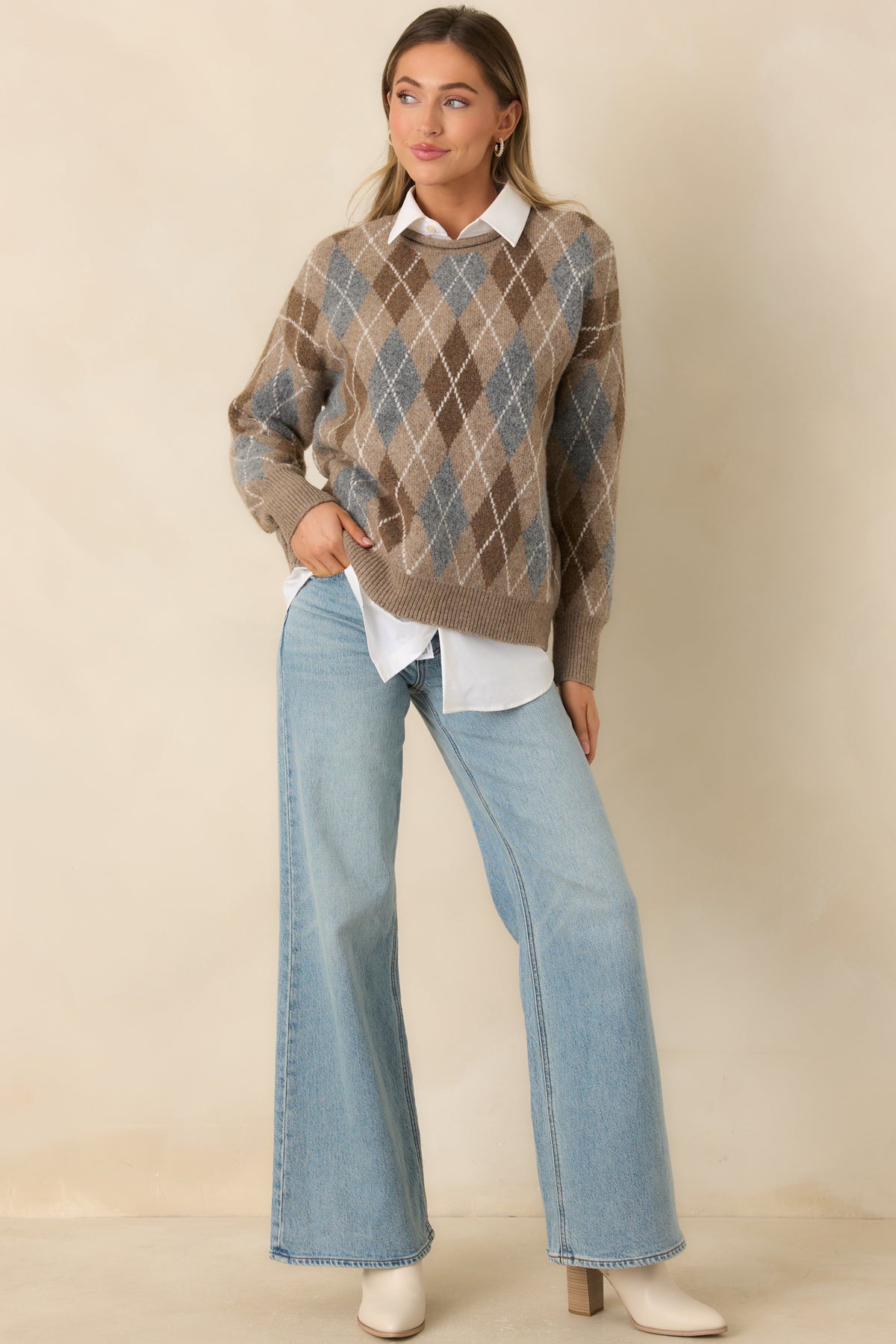 Textured argyle pullover with cream geometric lines, a relaxed fit, and a ribbed bottom hem.