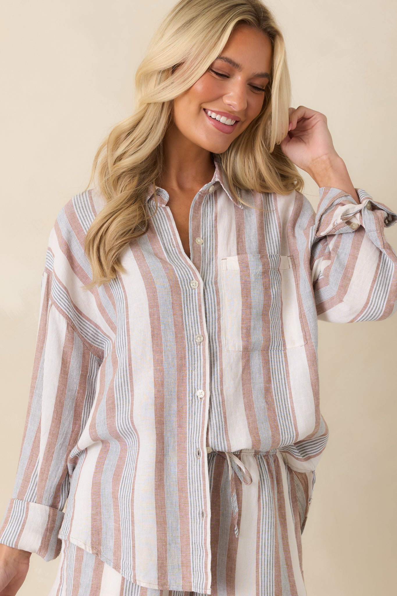 Detailed look at the beige and green vertical stripe pattern and textured linen-rayon fabric.