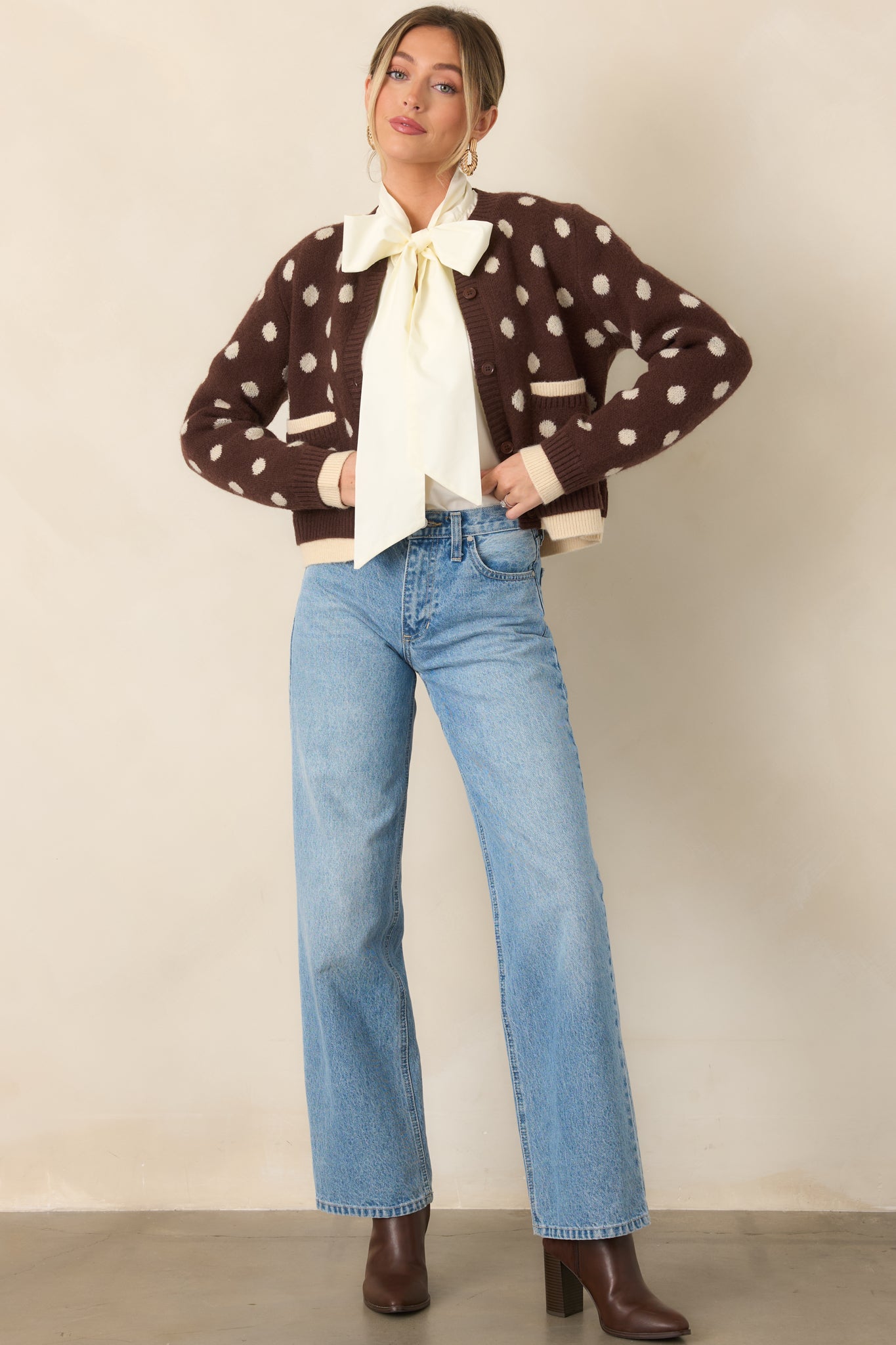 Textured brown cardigan showcasing an ivory dotted pattern, crew neckline, front buttons, and dimensional ivory accents along the edges.