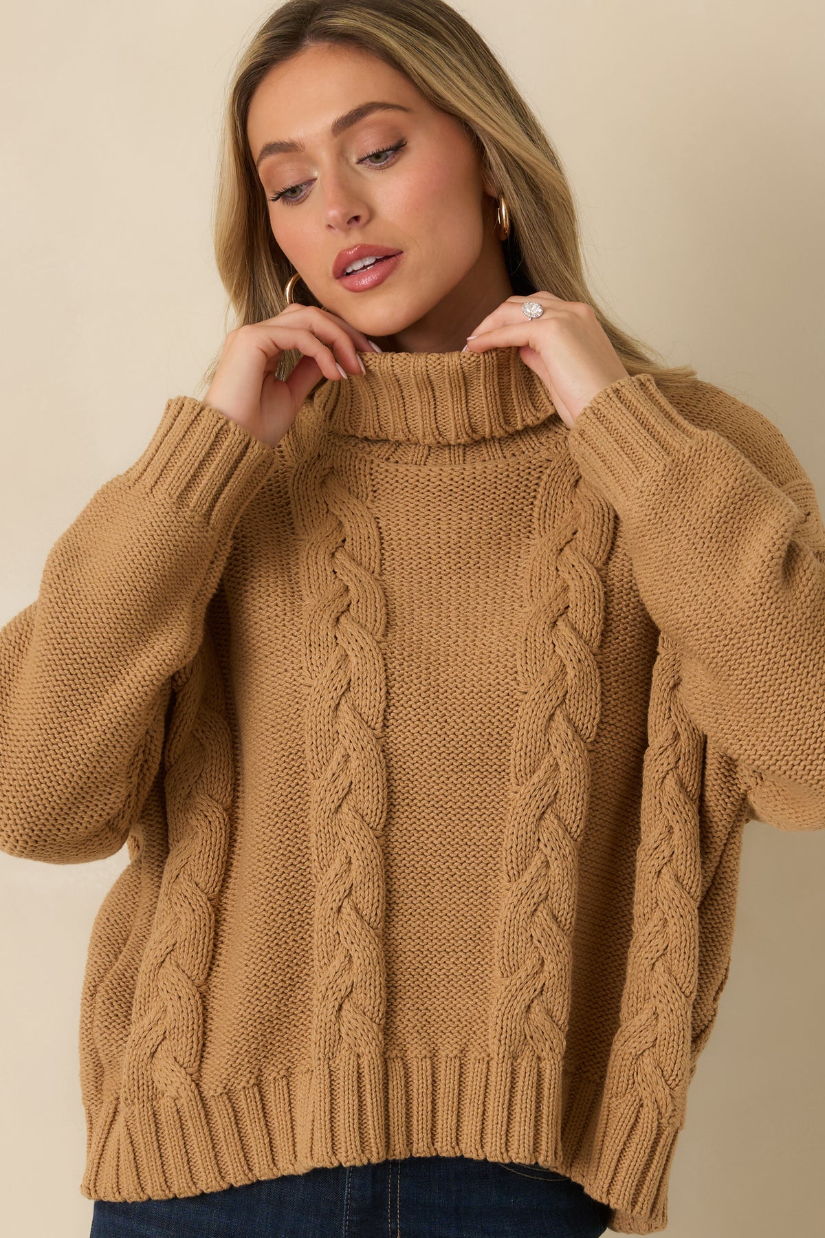 Textured cable knit sweater featuring relaxed sleeves, ribbed cuffs, and a polished coordinating ribbed hem.
