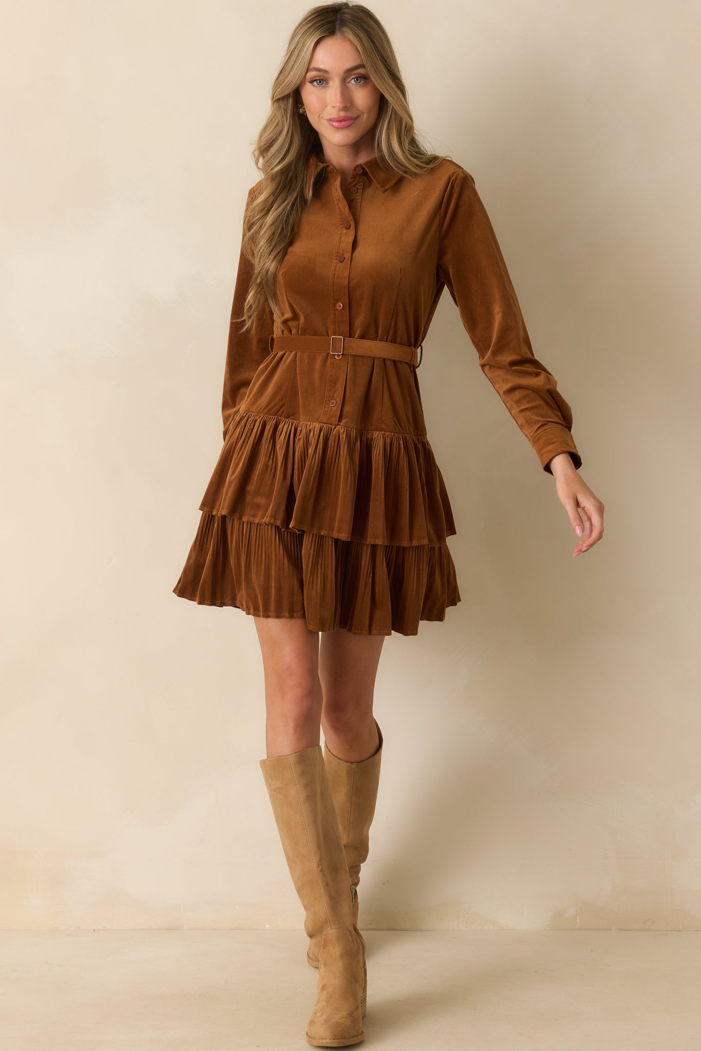 Textured corduroy dress with long sleeves, collared bodice, and relaxed mini silhouette.