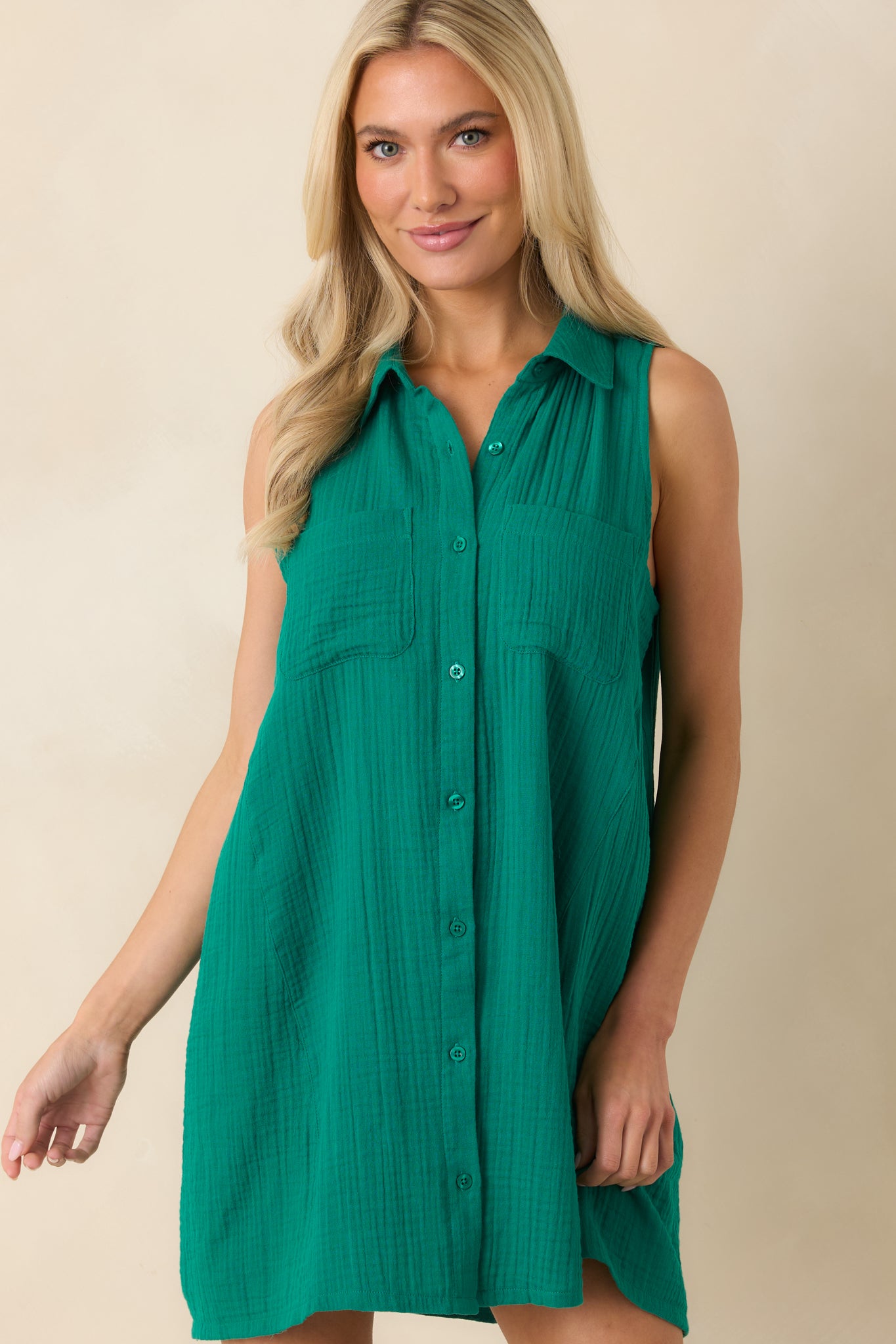 Textured cotton mini dress featuring the classic collar, pocket details, and comfortable relaxed silhouette.
