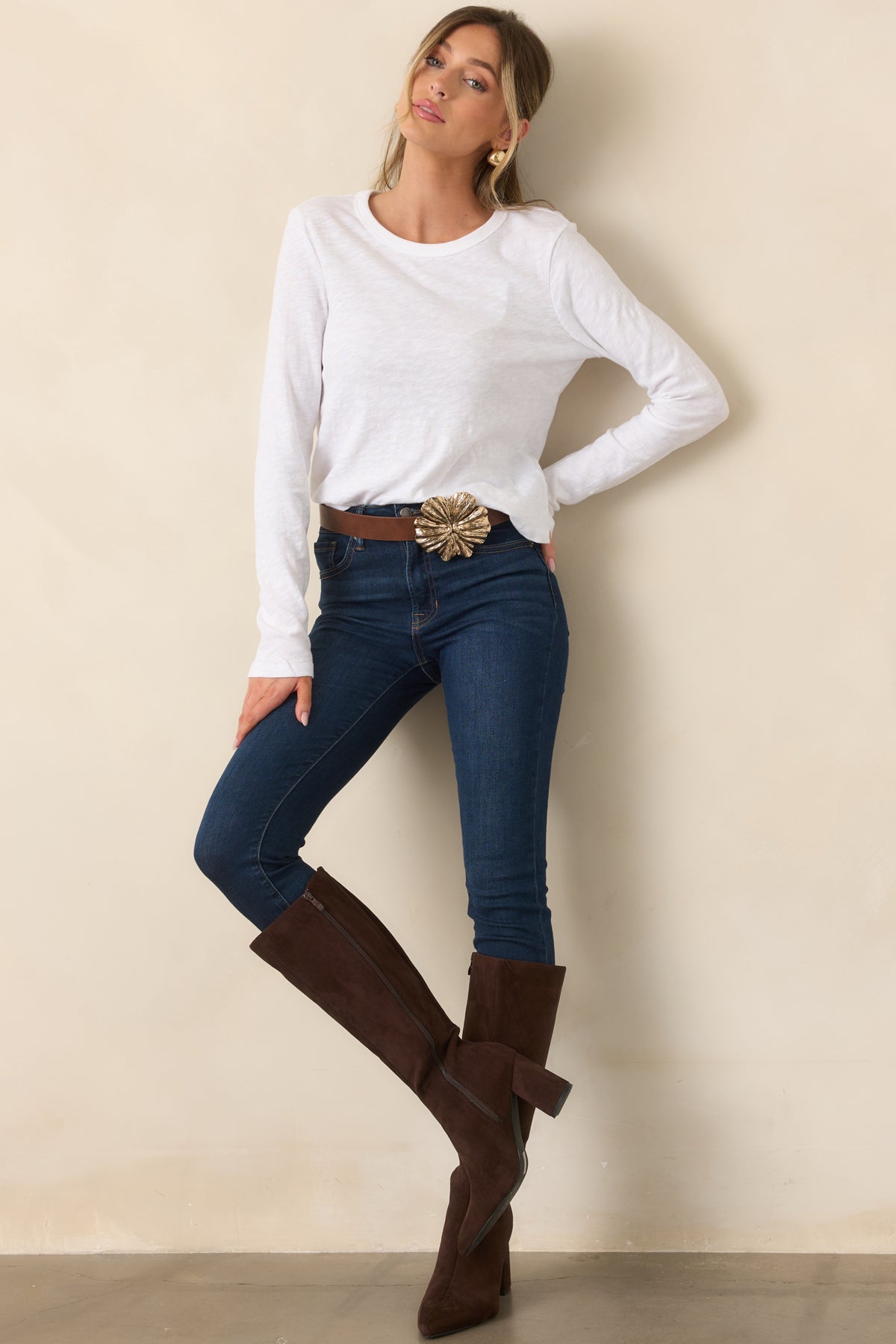 Softly textured cotton jersey top with a classic crew neckline, long fitted sleeves, and a streamlined waist-length silhouette.